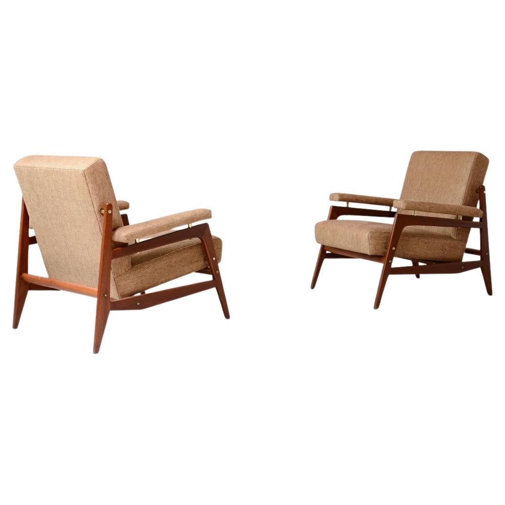 Pair of stylish modernist armchairs in wood and upholstery 