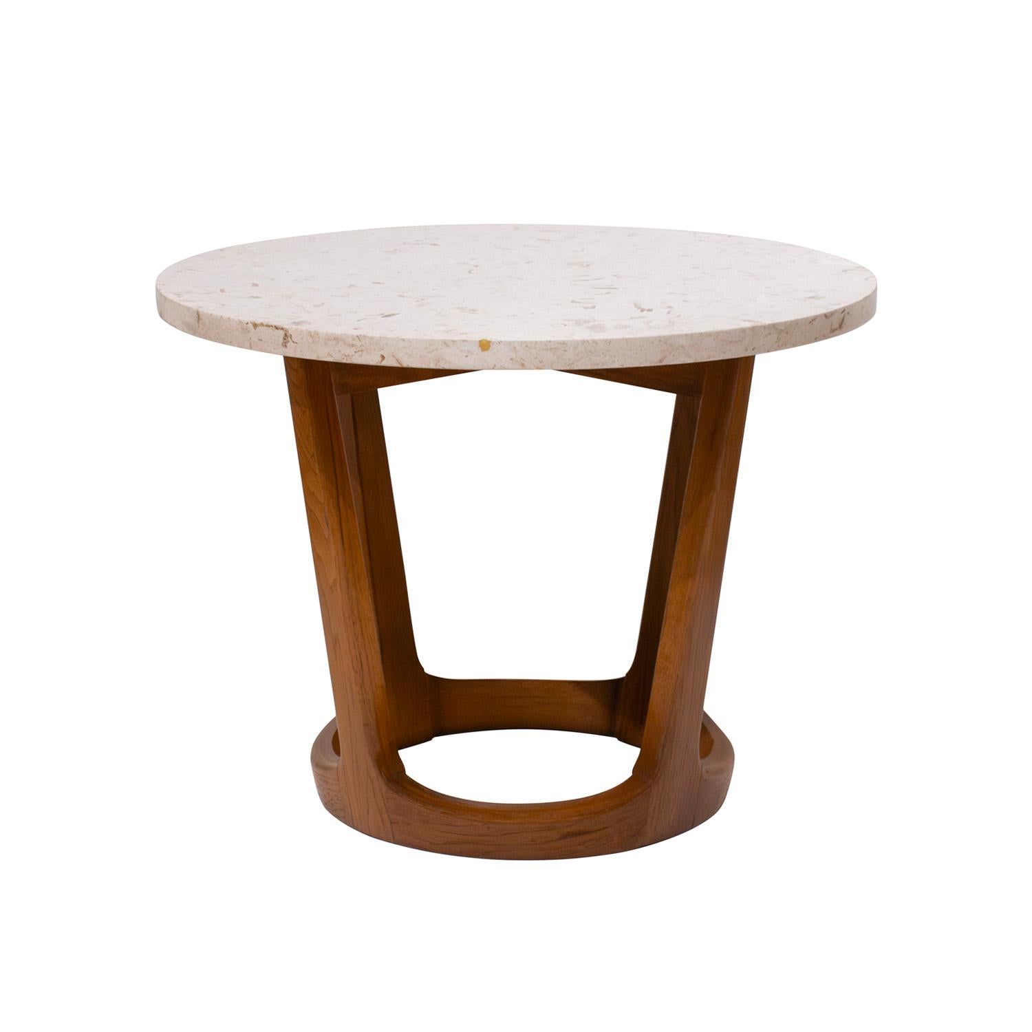 Pair of stylish round occasional tables with bases in walnut and polished fossilized granite tops, American 1950's. The combination of granite and walnut is very chic. These tables could be used as coffee tables or side tables.
