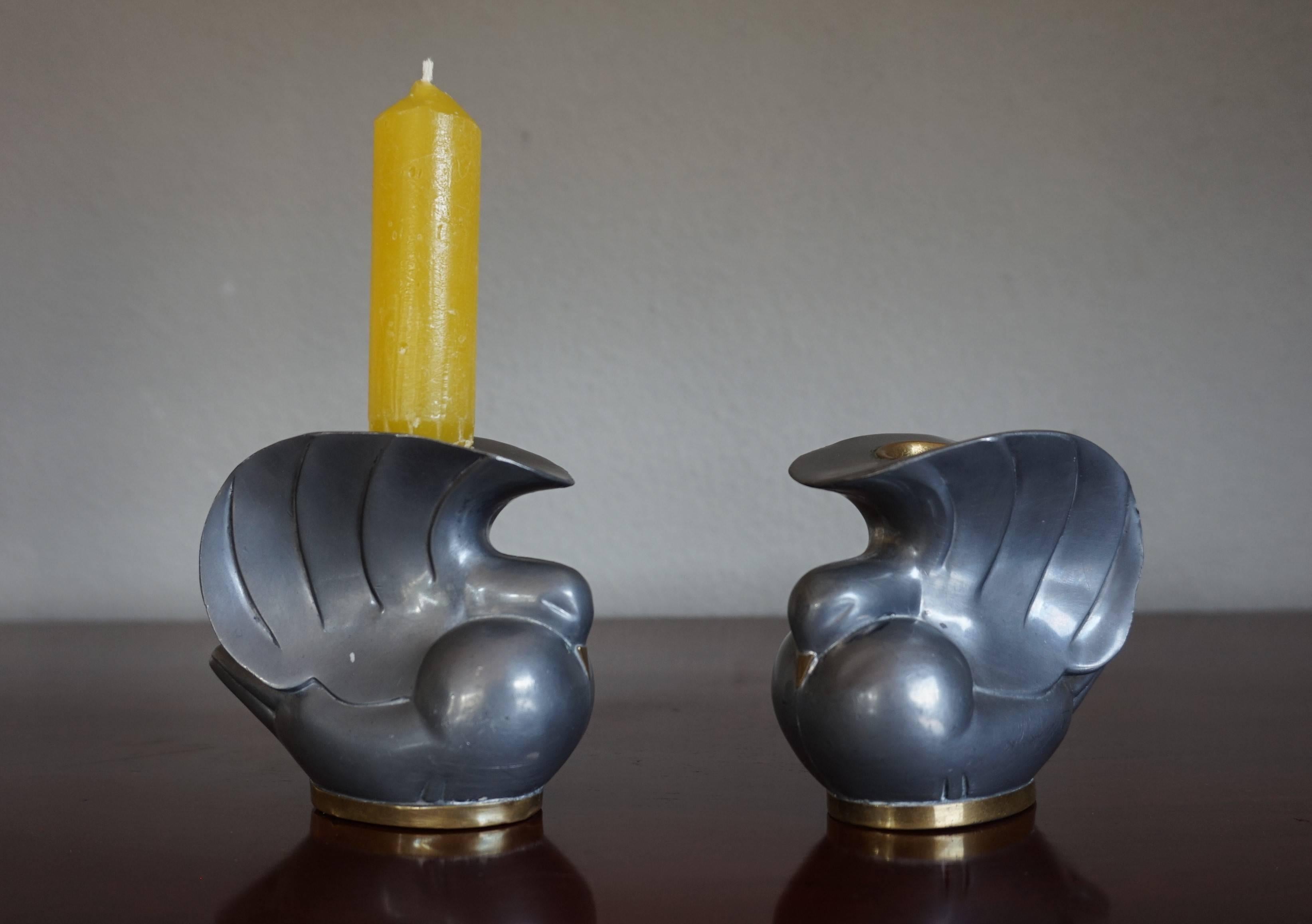 Highly stylish Art Deco dove candleholders.

We have searched the worldwide web for another pair, because we don't know the designer nor the maker of these very stylish, dove candle holders. Fortunately we have not found another pair which makes