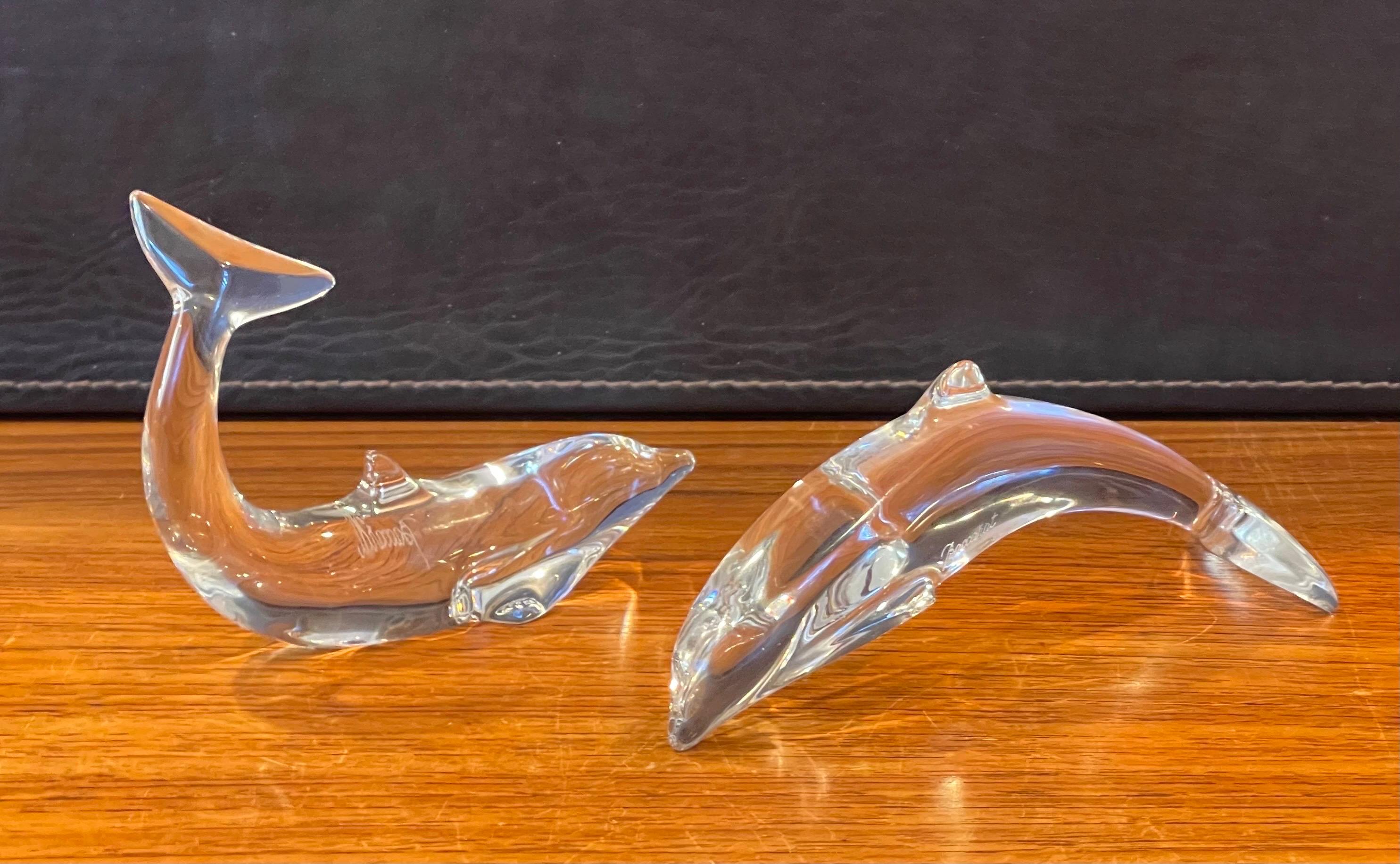 Gorgeous pair of stylized crystal dolphin sculptures / paperweights by Baccarat, circa 1990s. The set is in very good vintage condition with no visible imperfections and great clarity. Signed on the side, the pieces measure approximately 6.5