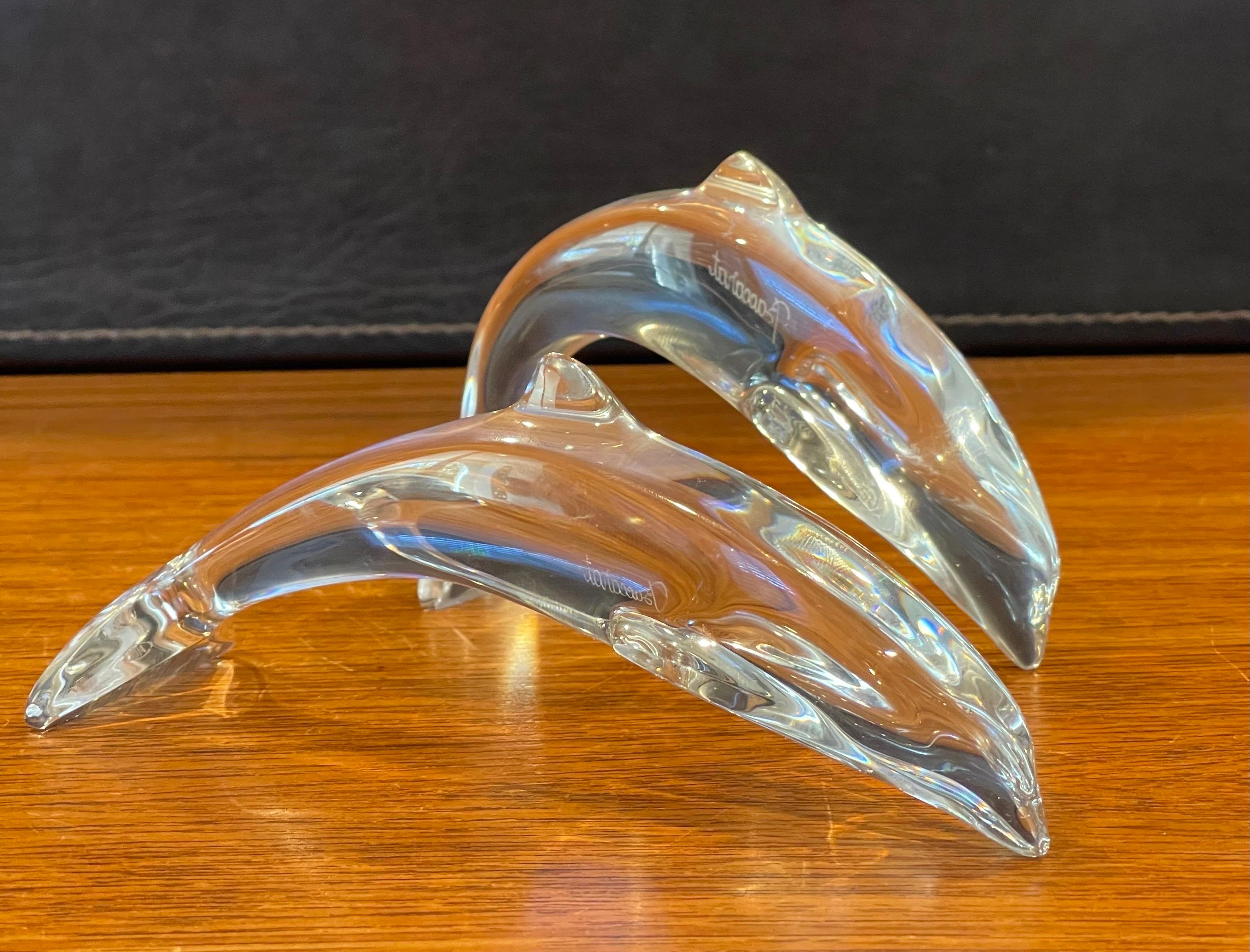 Gorgeous pair of stylized crystal dolphin sculptures / paperweights by Baccarat, circa 1990s. The set is in very good vintage condition with no visible imperfections and great clarity. Signed on the side, the pieces measure approximately 6.5