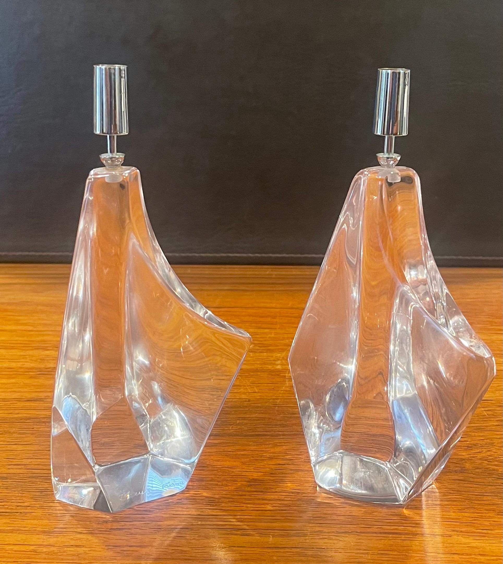 A very cool and rare pair of stylized crystal iceberg candlesticks by Daum France, circa 1960s. The pair of freeform crystal blocks with chrome candleholders are in very good vintage condition with no chips or cracks. They measure 4
