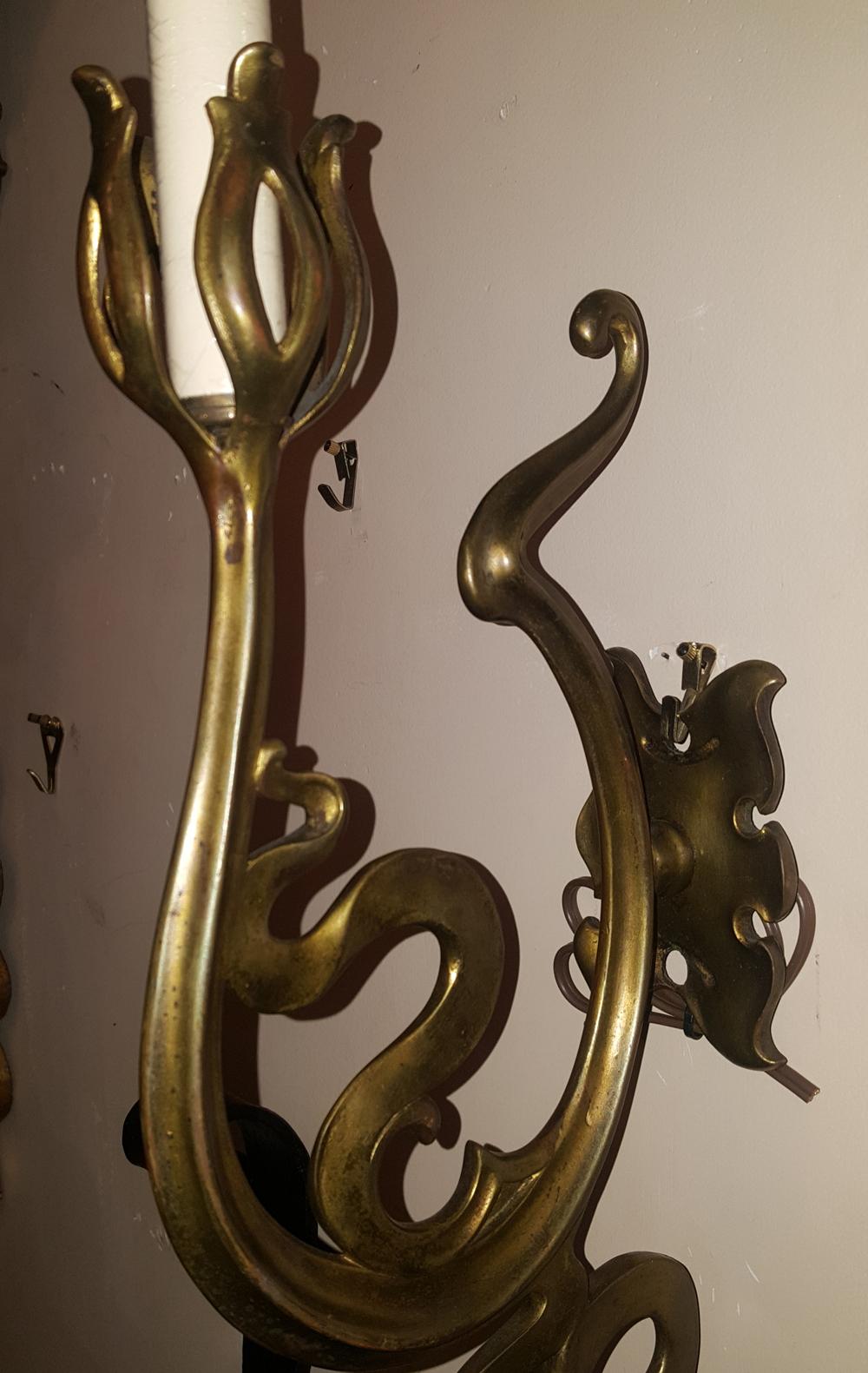 Pair of Art Nouveau bronze sconces with foliage motif. 

Measurements
Height: 17.25