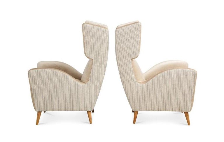 Mid-Century Modern Pair of Stylized Wing Chairs For Sale