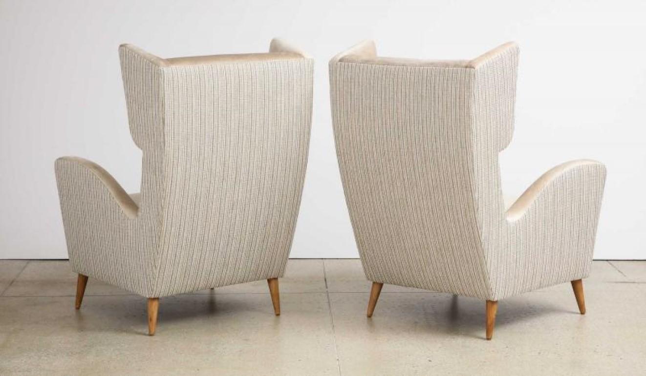 Wood Pair of Stylized Wing Chairs