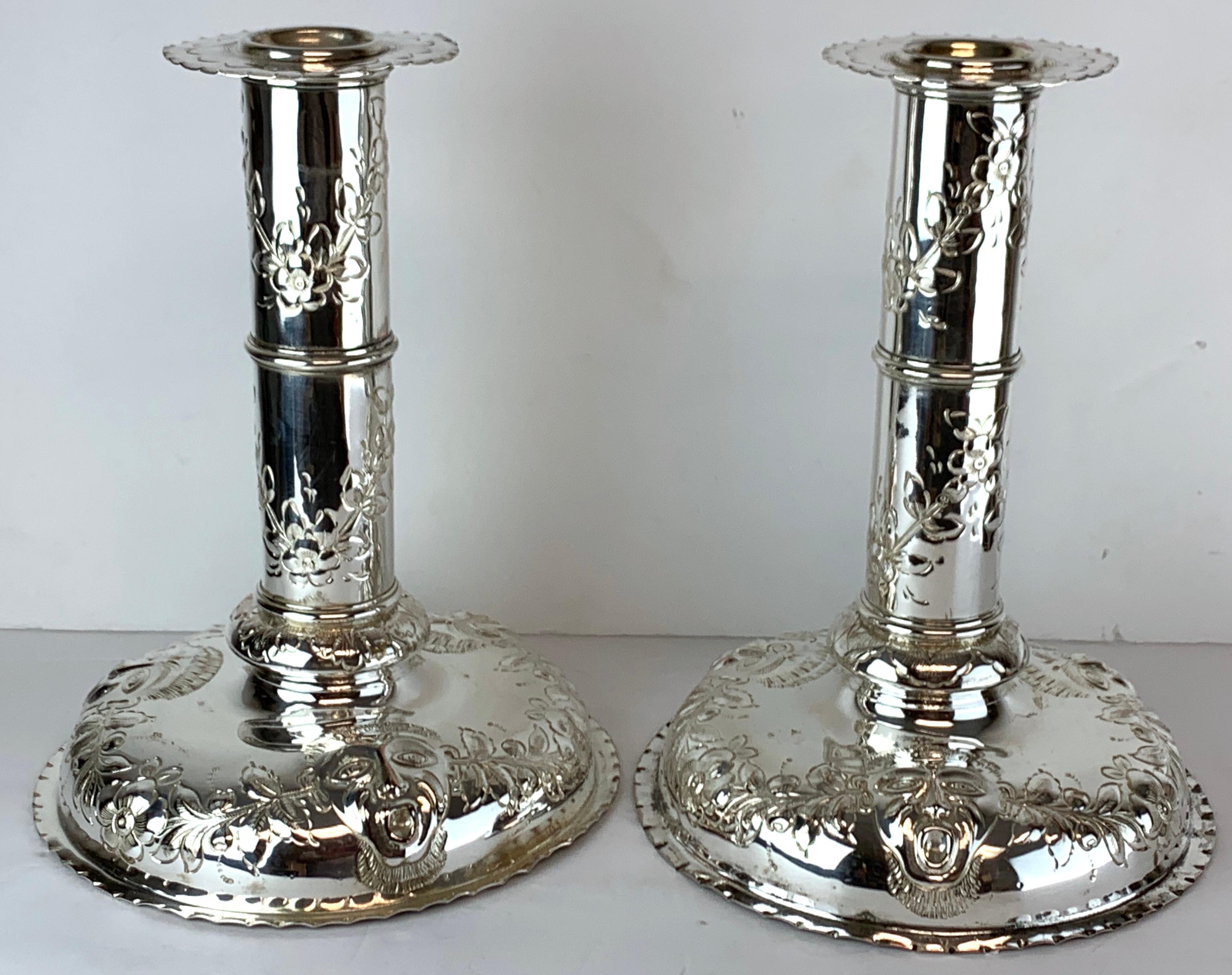 Pair of substantial antique Sheffield plate Venetian mask motif candlesticks. Each one with a 3.5