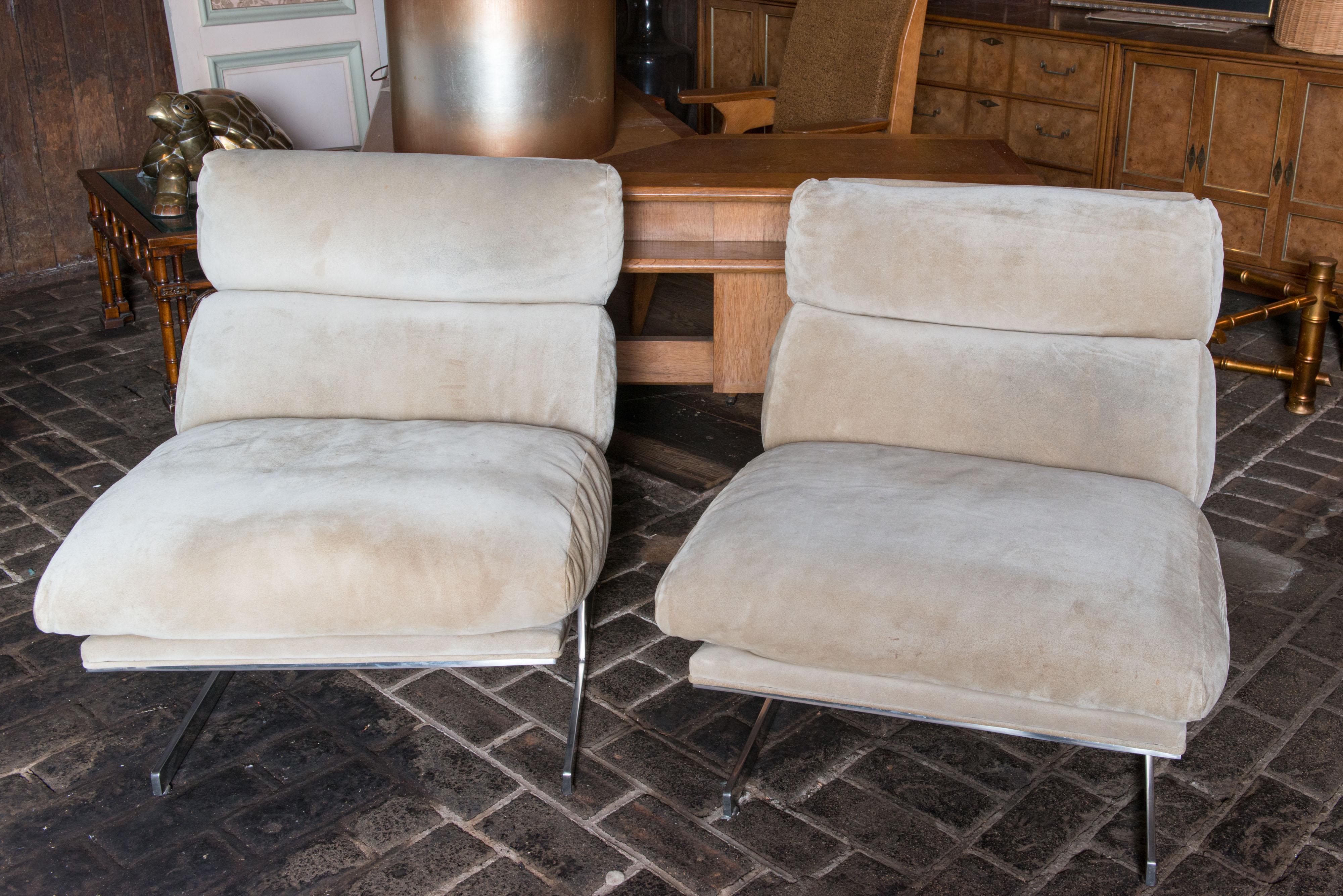 A comfortable and sophisticated pair of lounge chairs designed by Kipp Stewart in the 1970s for Directional. The streamlined steel base is chrome plated. The upholstery is off white suede in remarkably great condition.