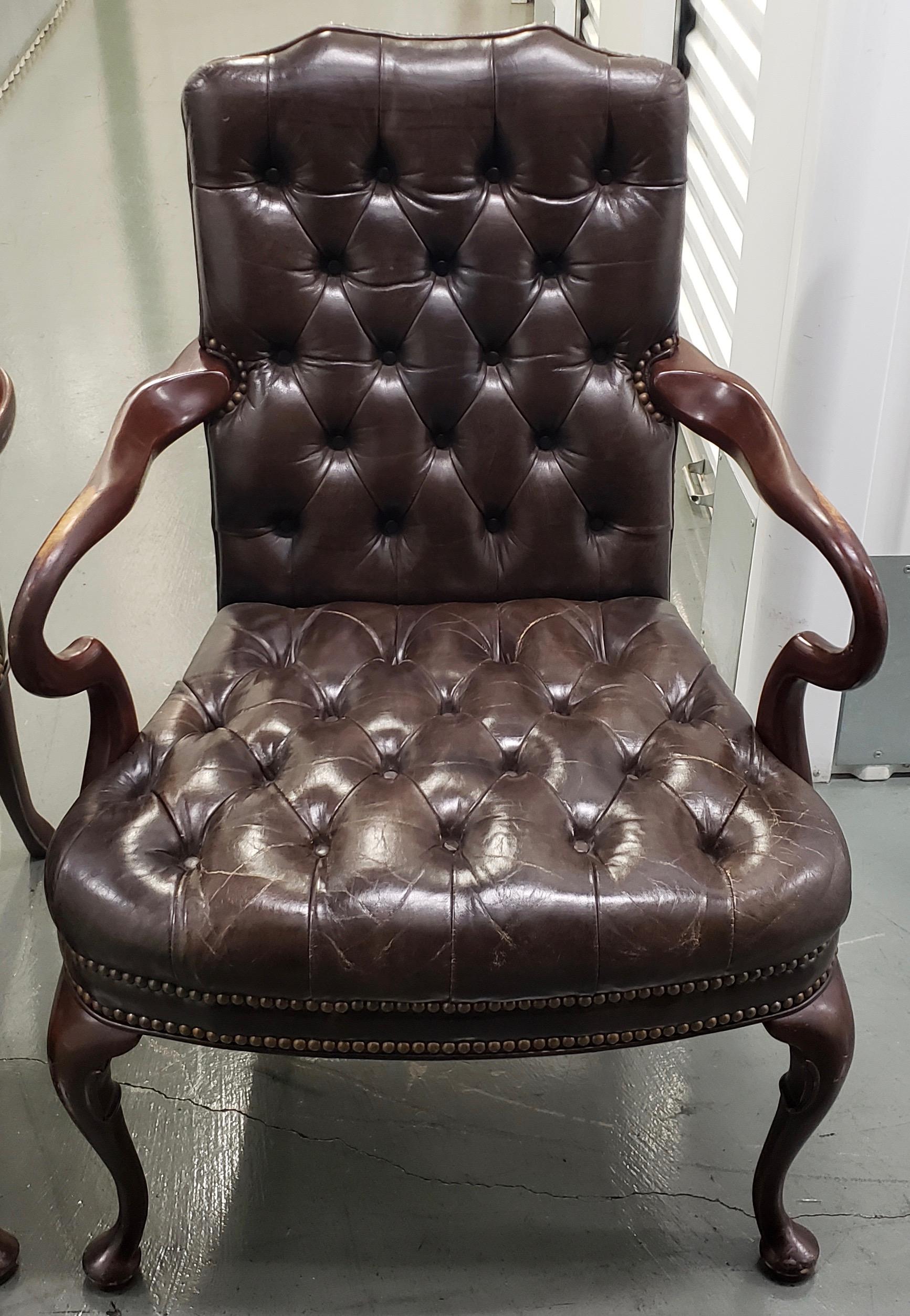 Pair of Sumptuous chocolate leather button down side chairs circa 1970s

Beautiful pair of rich mahogany and chocolate brown leather arm chairs. The supple leather is attached to the frame of the chair with brass tacks. The frames are made from