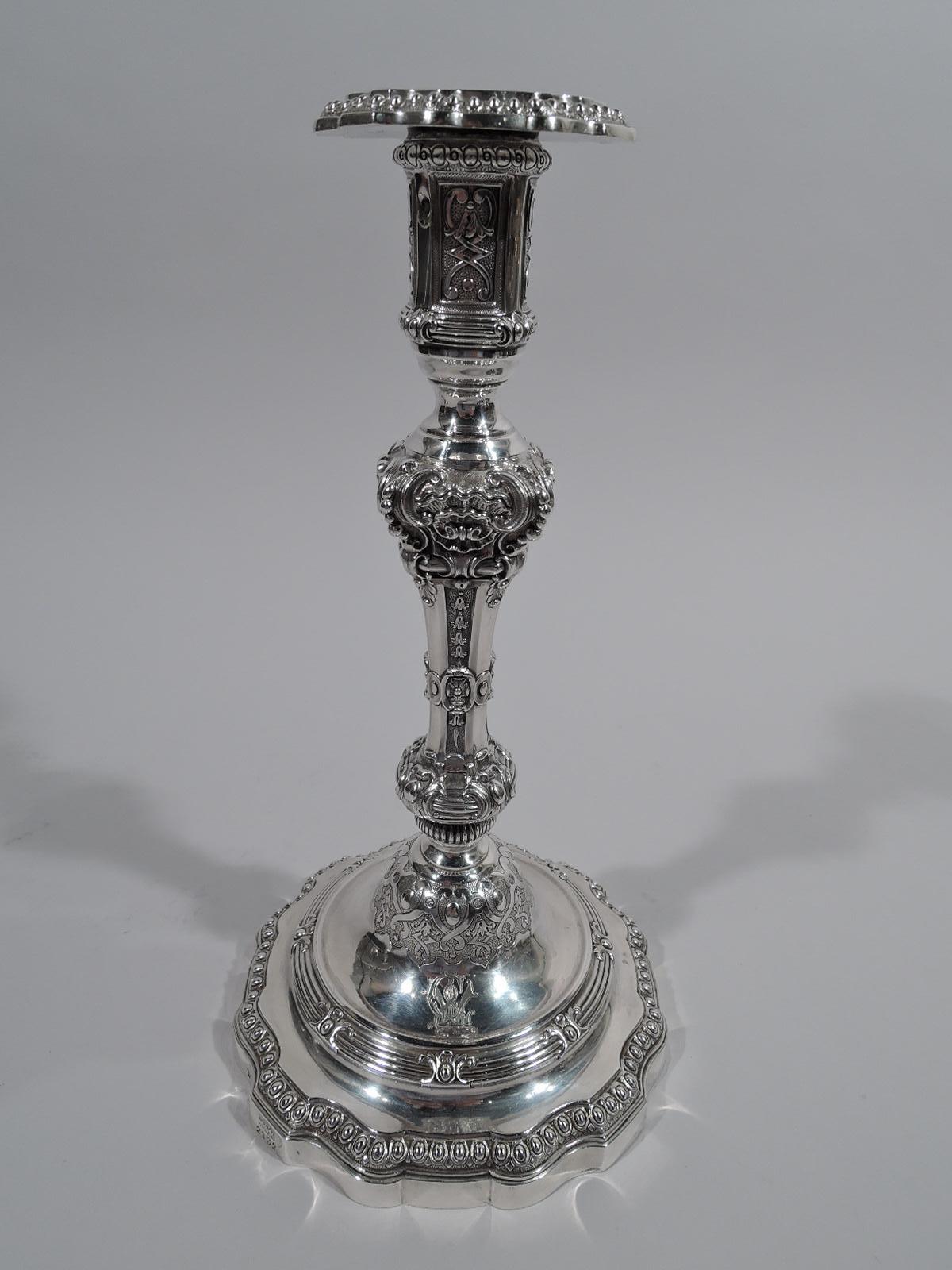 Pair of super sumptuous 950 silver candlesticks. Made by Odiot in Paris, circa 1860. Each: Knopped shaft on double-domed foot with curvilinear rim; tall and straight socket with detachable bobeche. Dense and chased Classical ornament with scrolls,