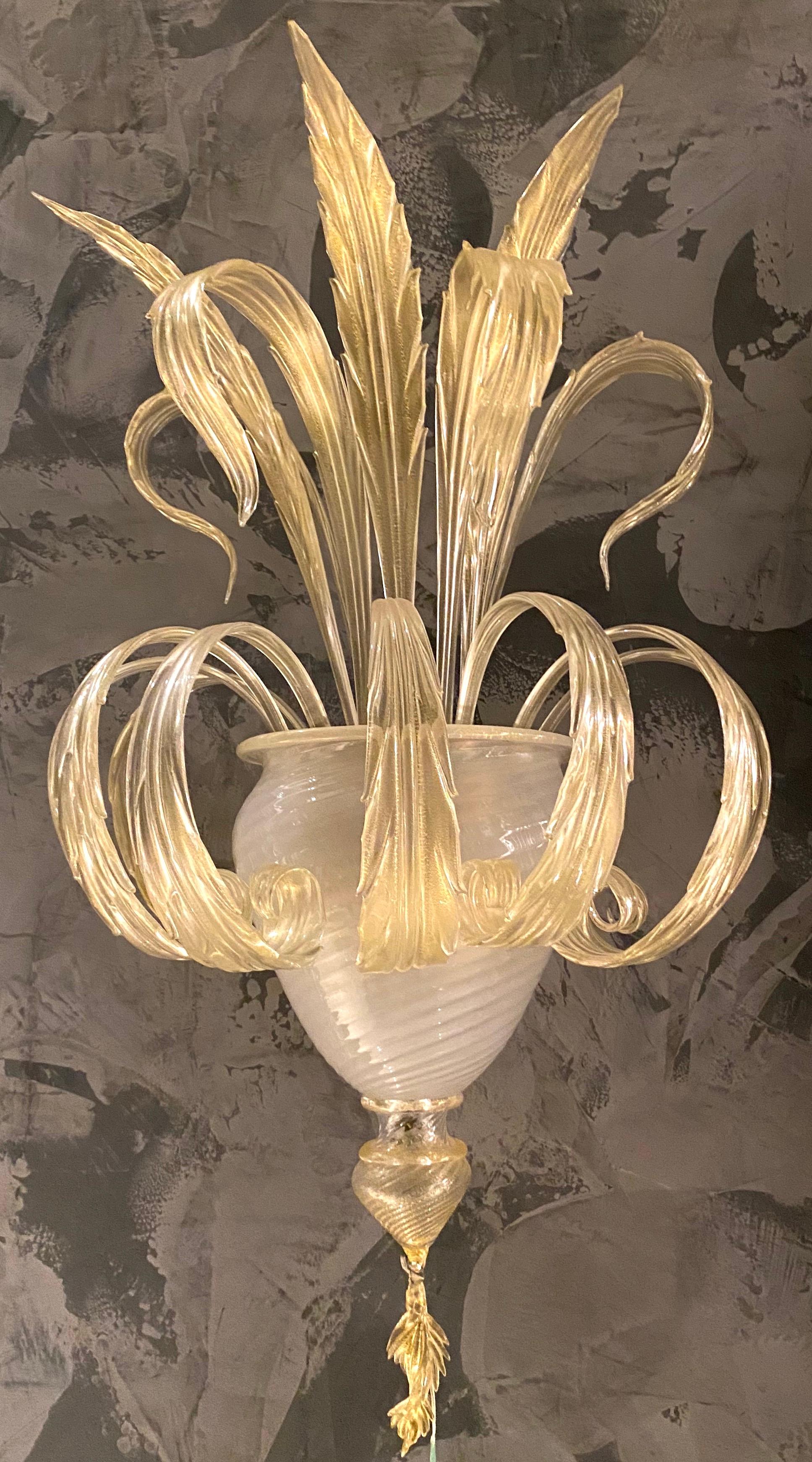 Pair of magnificent Murano glass leave sconces with elegant opaline bowl.
Glasses are in perfect condition.
Two E 27 light bulbs. We can wire for your country standards.
Edition limited from a great master of Venetian glass.
