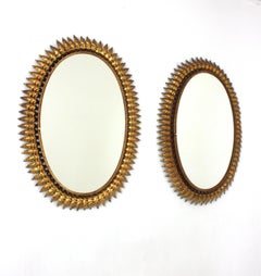 Paar ovale Spiegel mit Sonnenschliff aus vergoldetem Eisen, Spanien, 50er Jahre