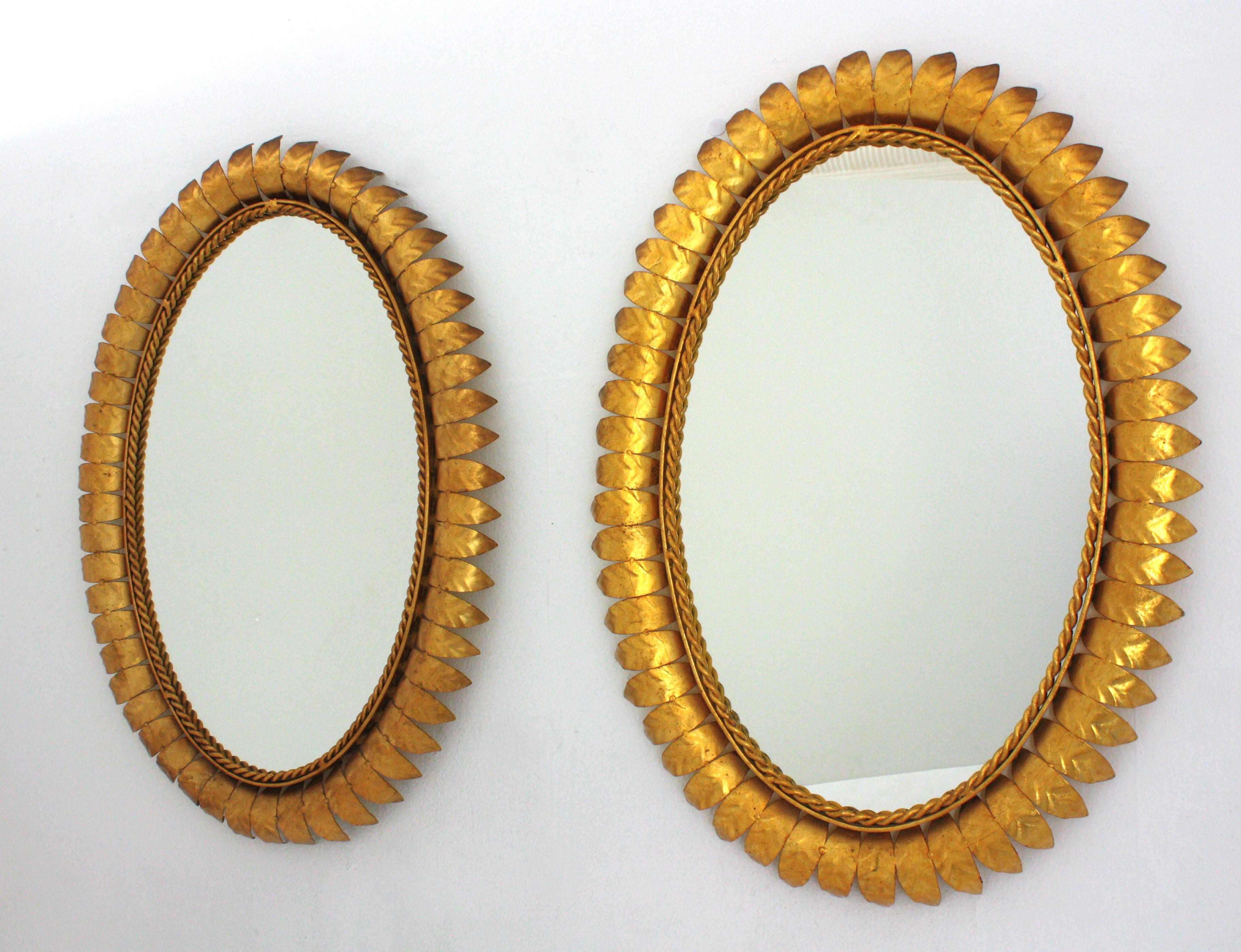 Pair of Sunburst Oval Mirrors in Gilt Metal For Sale 4