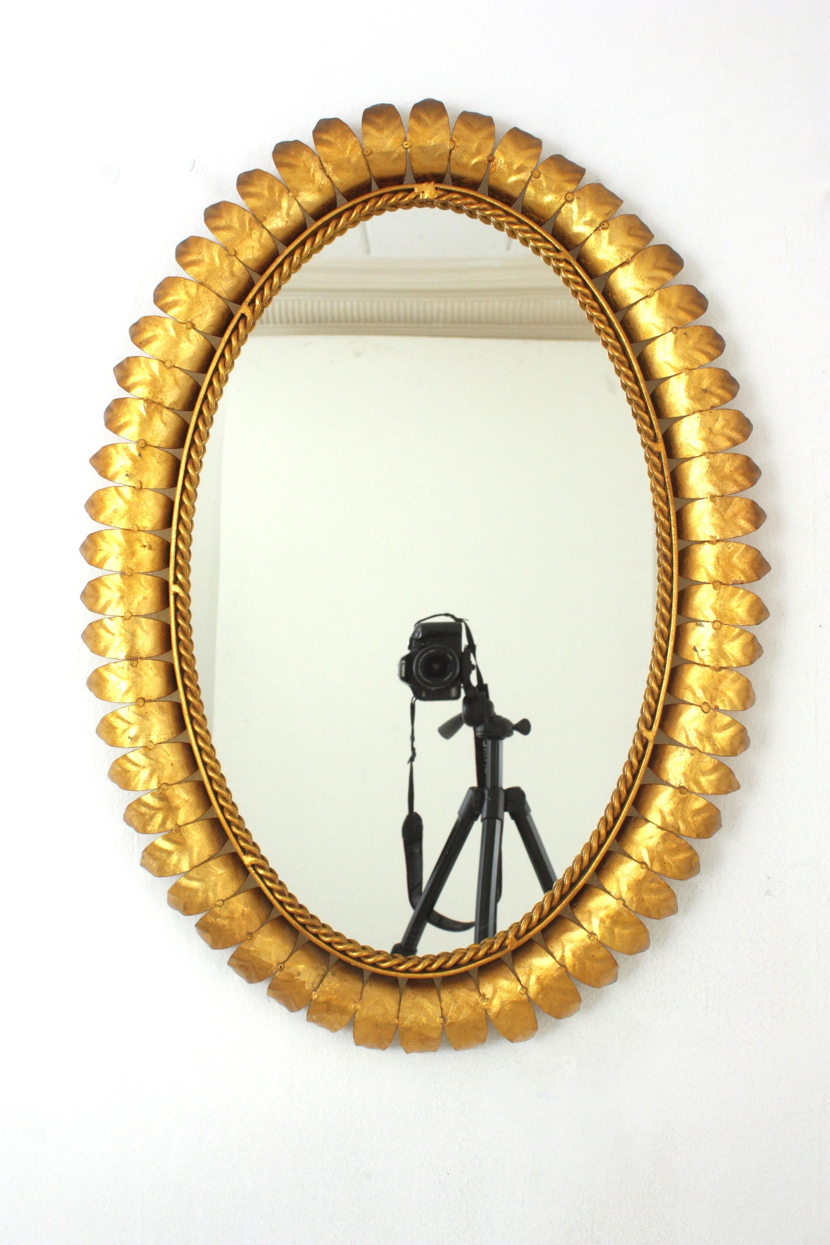 20th Century Pair of Sunburst Oval Mirrors in Gilt Metal, 1950s For Sale