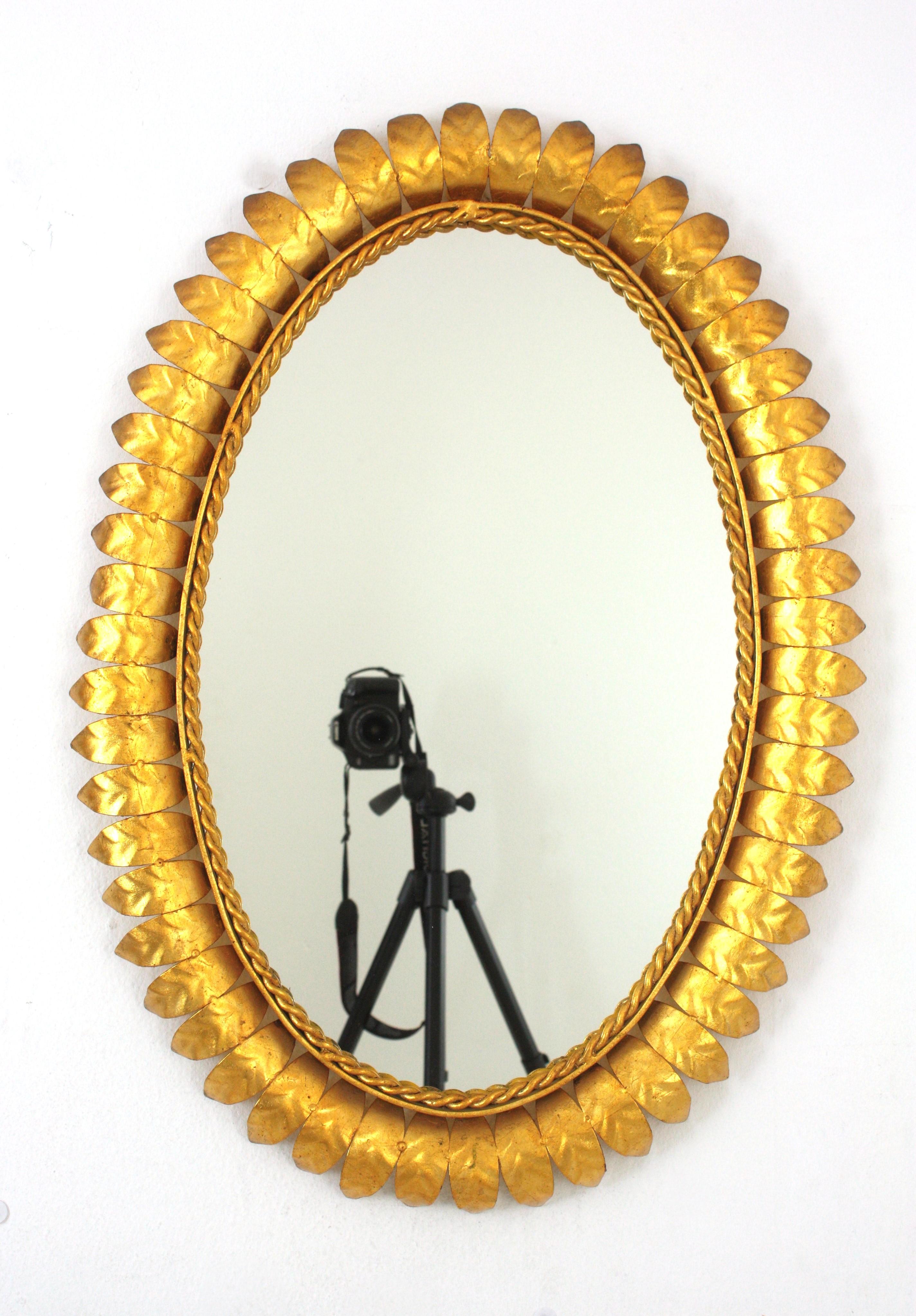 Pair of Sunburst Oval Mirrors in Gilt Metal For Sale 2