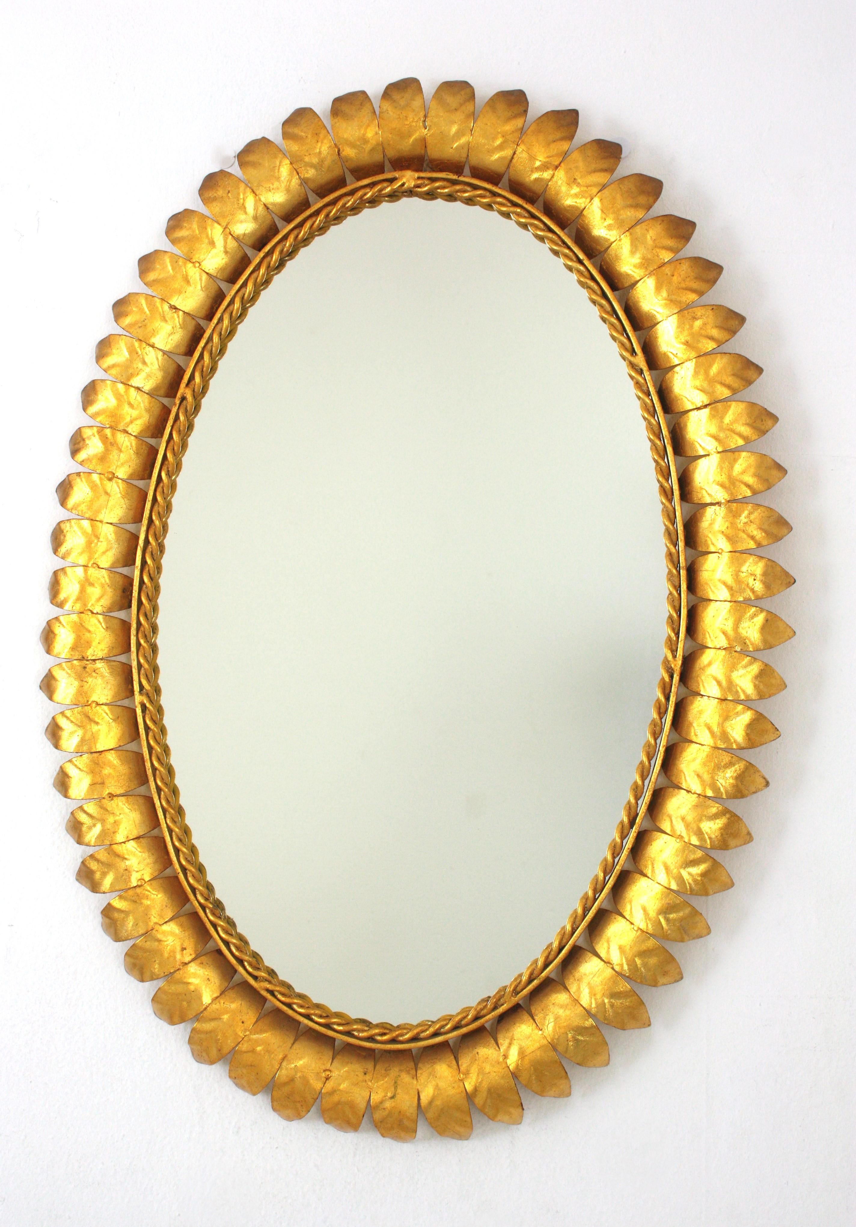 Pair of Sunburst Oval Mirrors in Gilt Metal For Sale 3