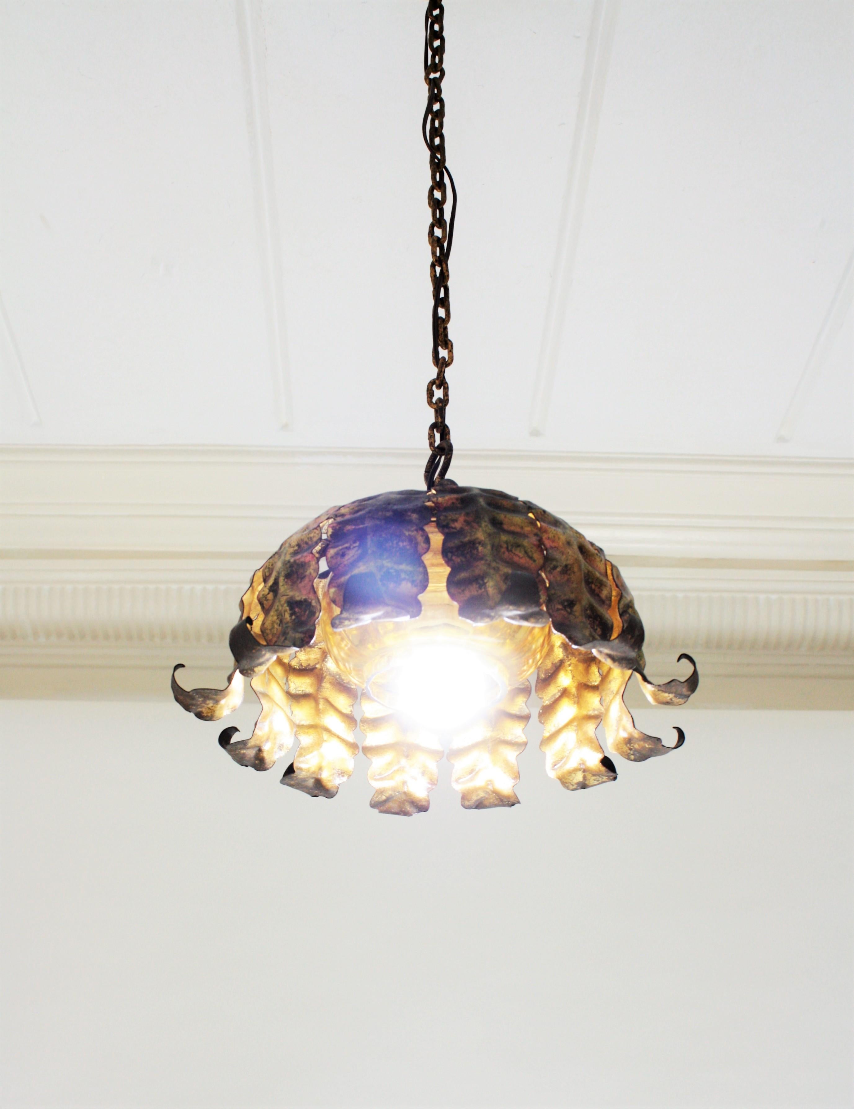 Pair of Spanish Sunburst Pendant Lights in Gilt Iron and Amber Glass For Sale 4