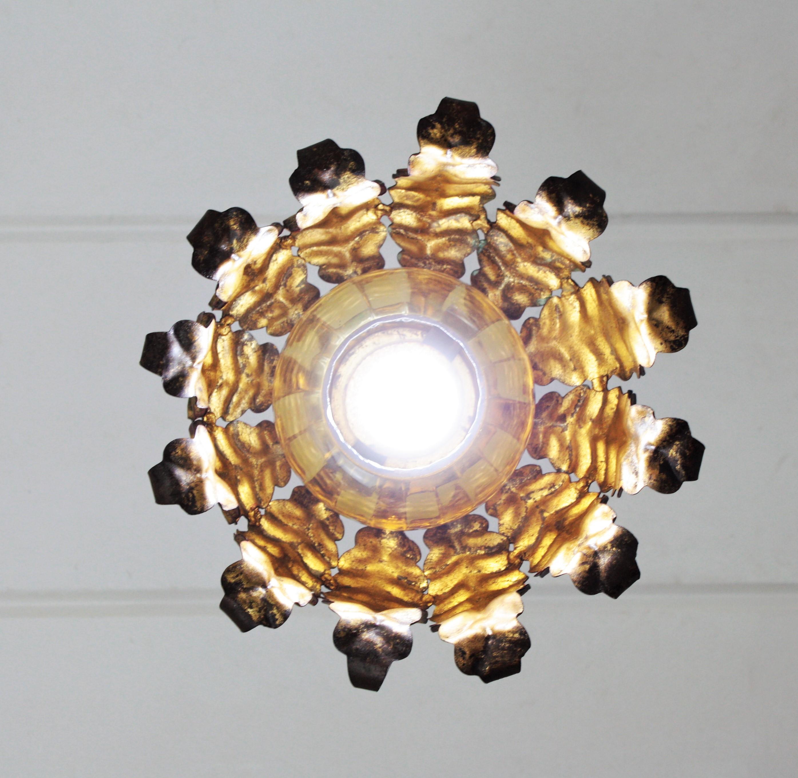 Pair of Spanish Sunburst Pendant Lights in Gilt Iron and Amber Glass For Sale 7