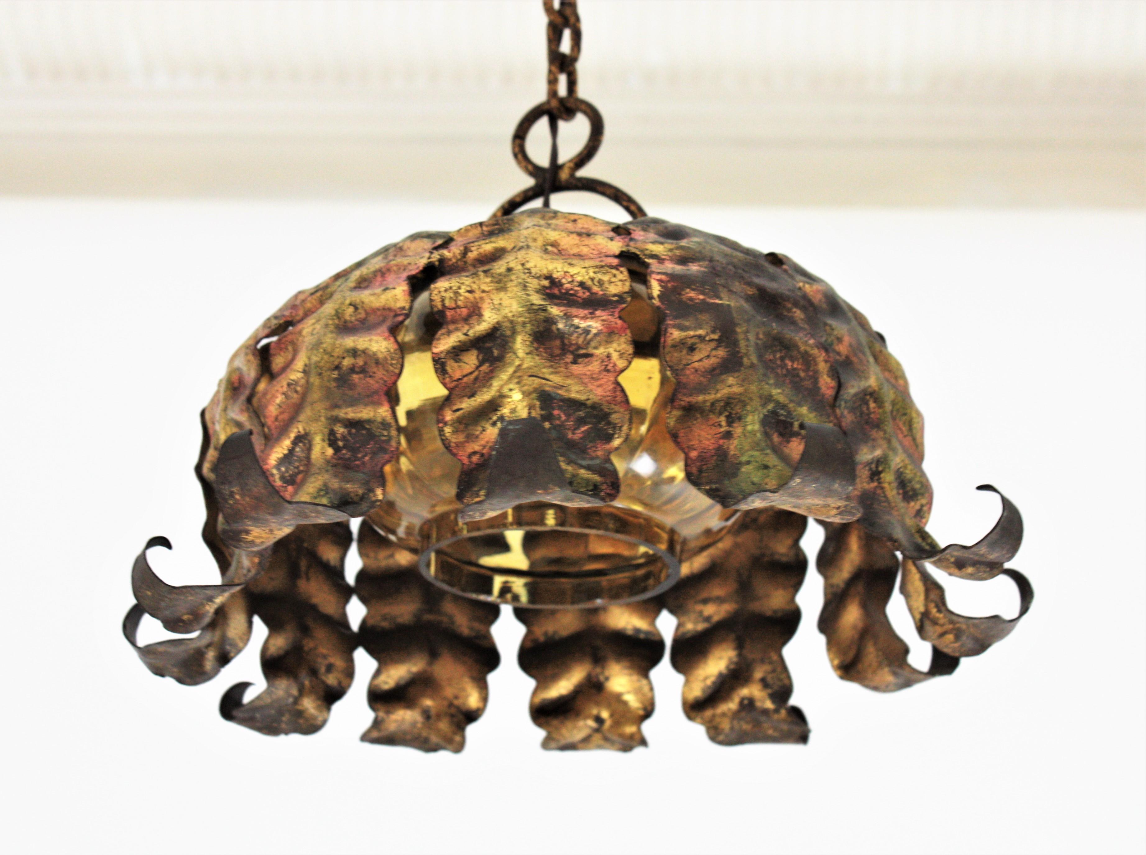 Hand-Crafted Pair of Spanish Sunburst Pendant Lights in Gilt Iron and Amber Glass For Sale