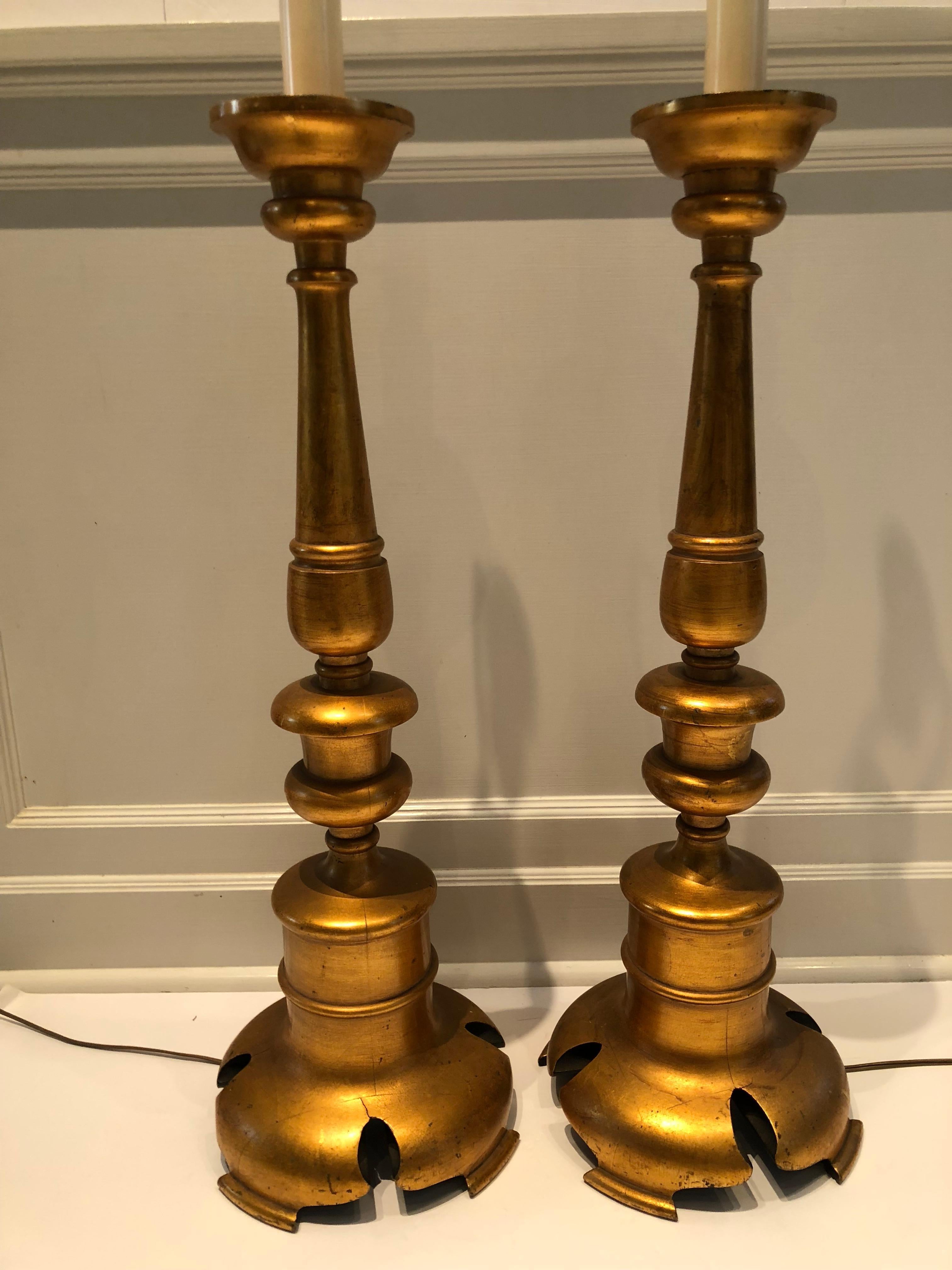 Italian giltwood columns with custom black shades lined in metallic gold. Round black ball finial. Base is 10