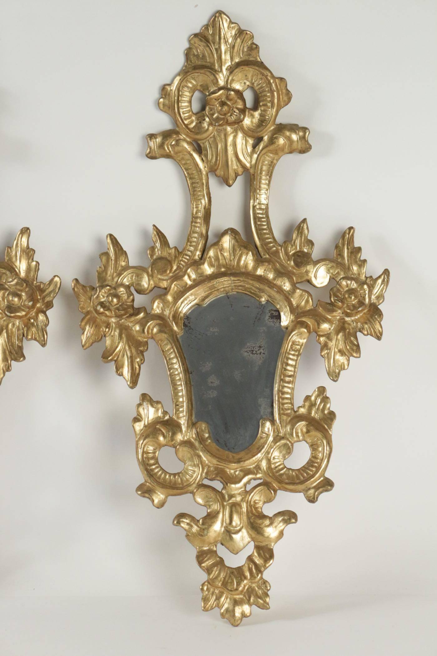 Pair of superior quality gold gilt wooden hand-carved mirrors Napoleon III.  
h: 73cm, l: 40cm, p: 15cm
.