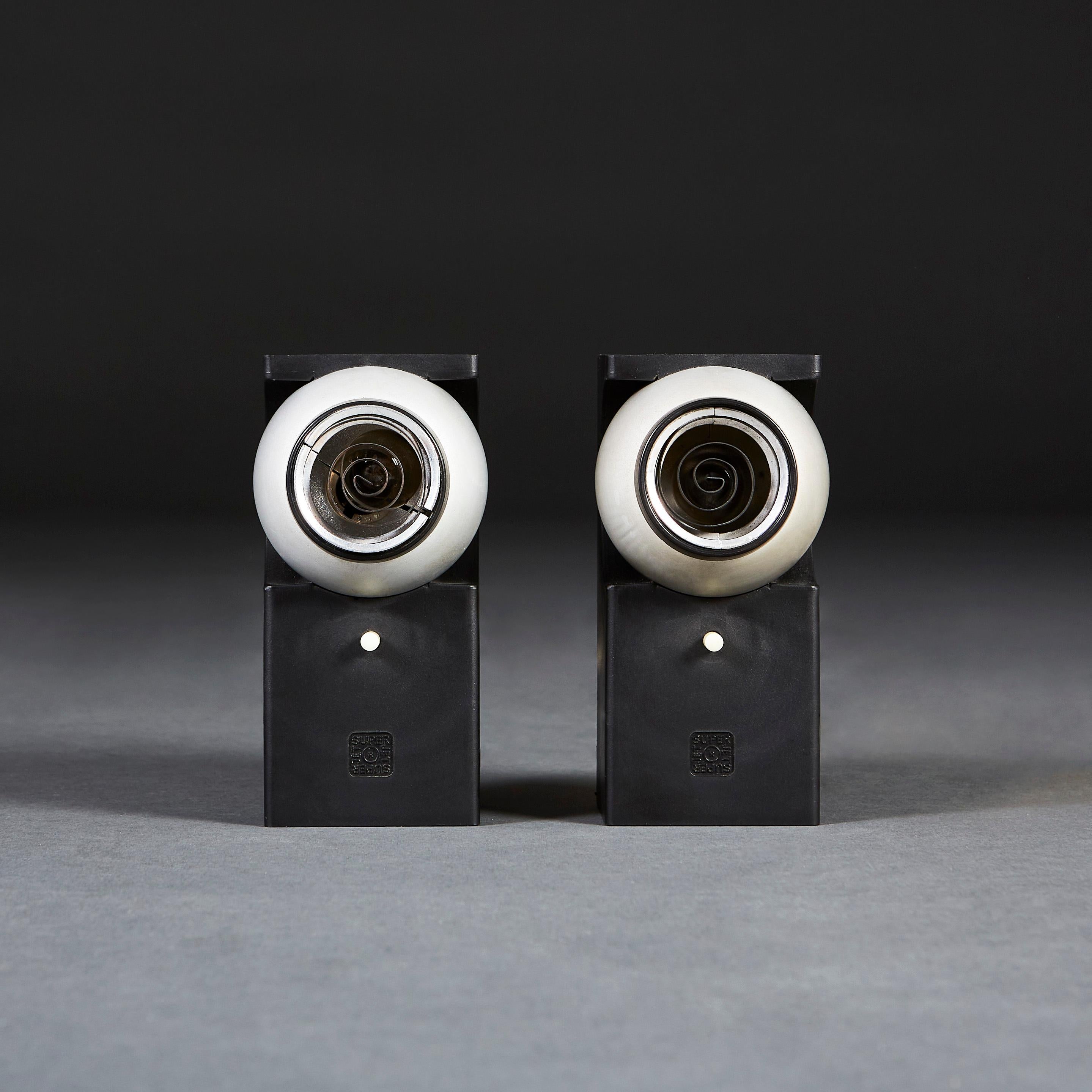 A pair of Superjet spotlights, designed by Robert Heritage for Concord Lighting International Ltd. The Superjet low-voltage reading light with moulded black polypropylene body and rotating anodized aluminum head with spiraling metal covers. Winner