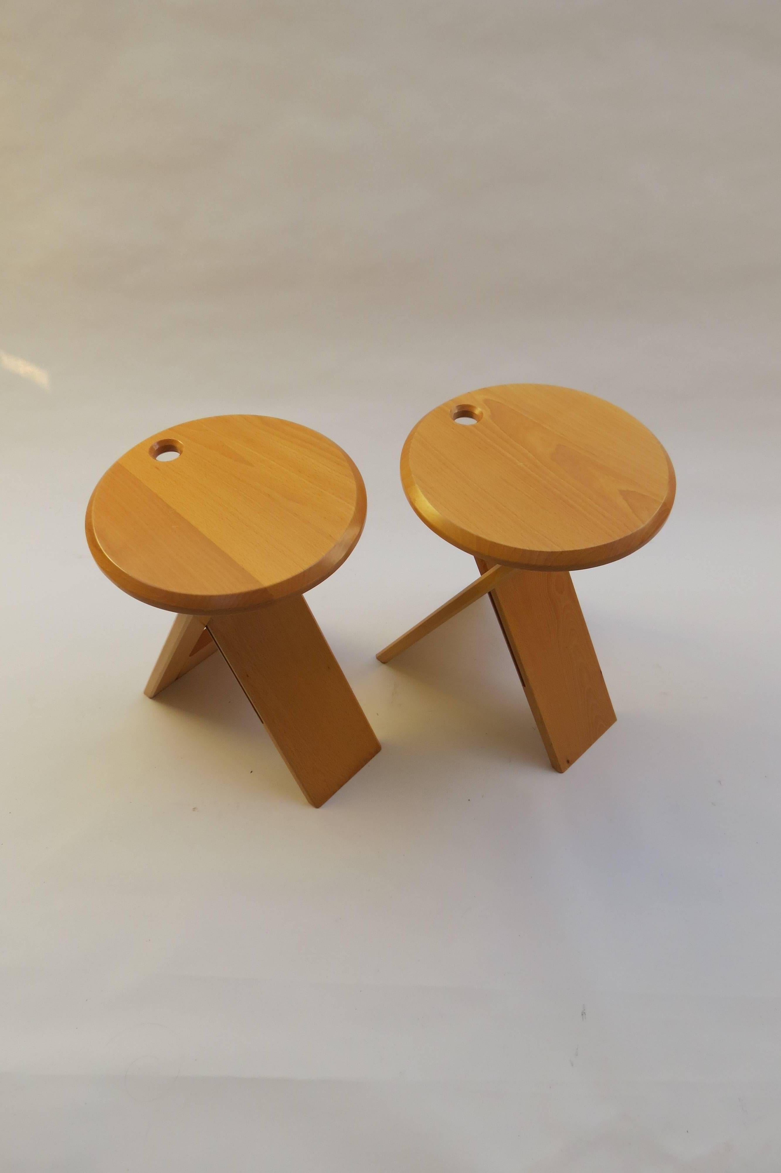 Pair of Suzy stools, designed 1984-1985 by Adrian Reed for Princes Design Works Ltd.
Can be used as stools or as side tables.
Solid beech with plastic/rubber hinges. The stools fold flat when not in use and come with the original hangers, painted