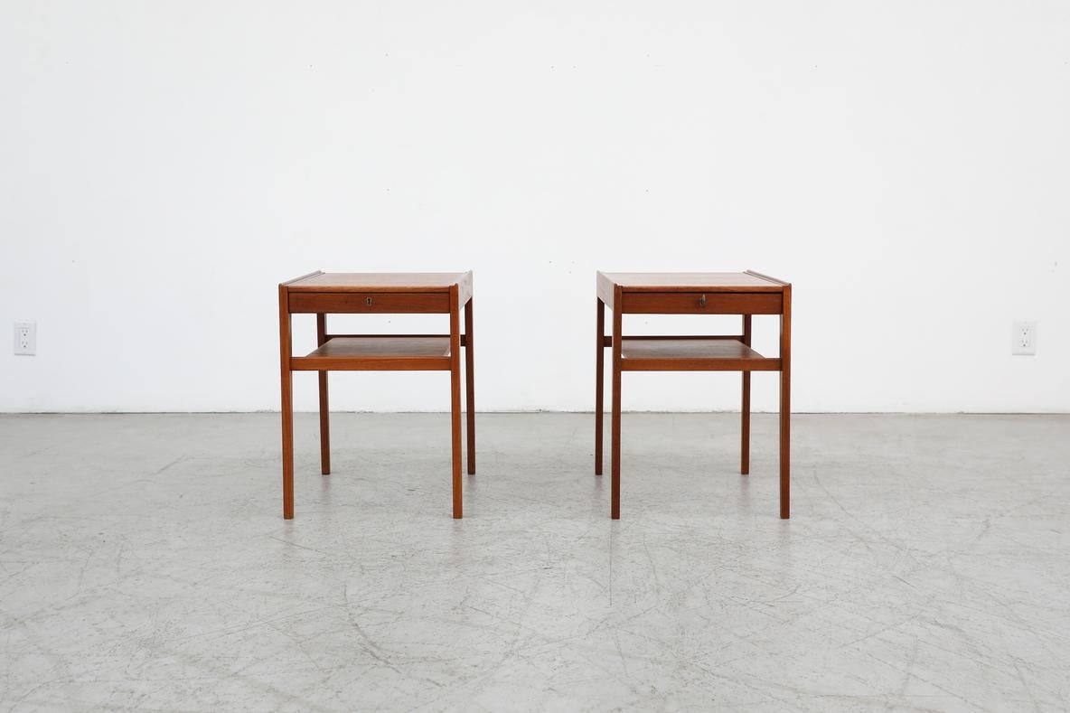 Model 'Dixi' pair of Mid-Century modern teak side tables or night stands designed by Gunnar Myrstrand and Sven Engström for Tingströms, Sweden 1960. Tables can be used as nightstands or side tables. Each table has a small locking drawer and a lower