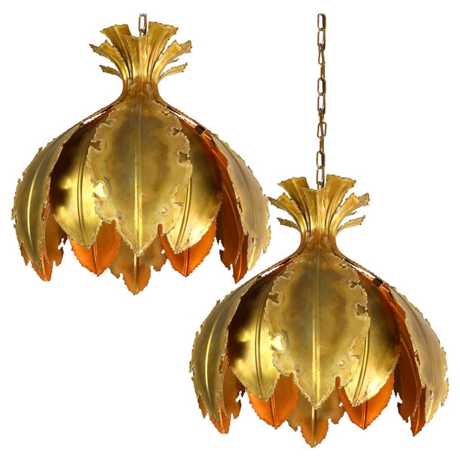 Pair of Svend Aage for Holm Sorensen Brutalist acid treated brass pendant lamps. Manufactured in Denmark during the 1960s. Original and well kept. Each Brutalist pendant ceiling light composed of large acid treated leaves welded together.

The lamp