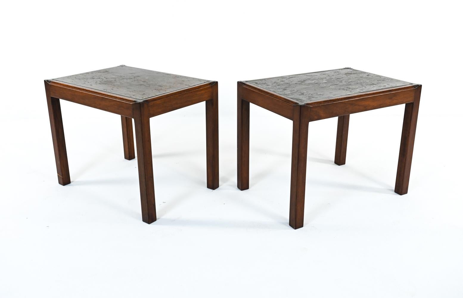 A fabulous pair of Scandinavian modern end or side tables in warm stained mahogany with an unusual inset slate tops, with texture and rich tones of bronze, gray, and umber. A transitional Brutalist design, c. 1970's, designed by Danish architect