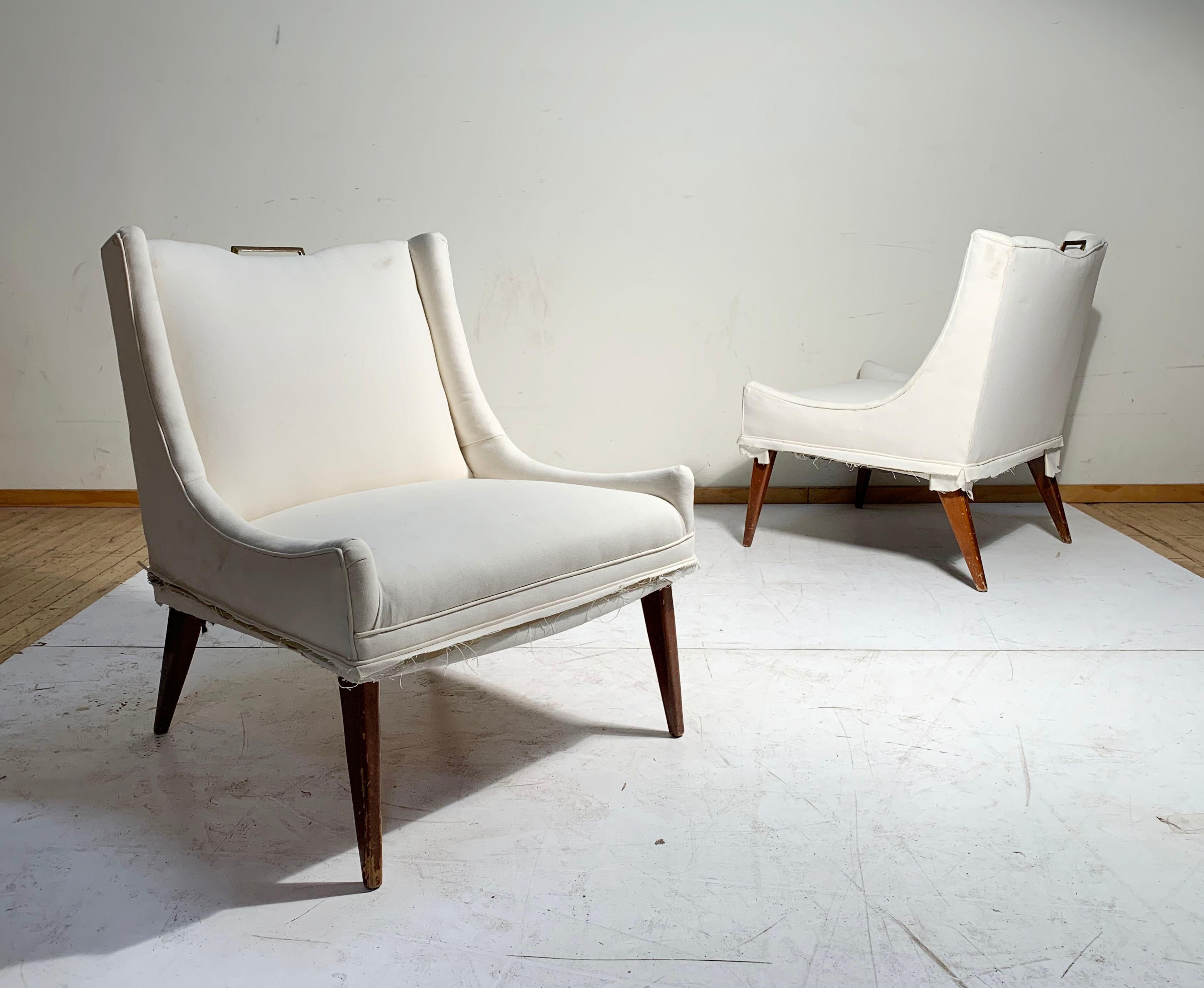 Sexy and swank pair of vintage Mid-Century Modern / Hollywood Regency  lounge chairs in style of Milo Baughman  Harvey Probber. Very good design. No labels attached. Of the period. Nice patina to brass handles. Could possibly be Italian in origin.