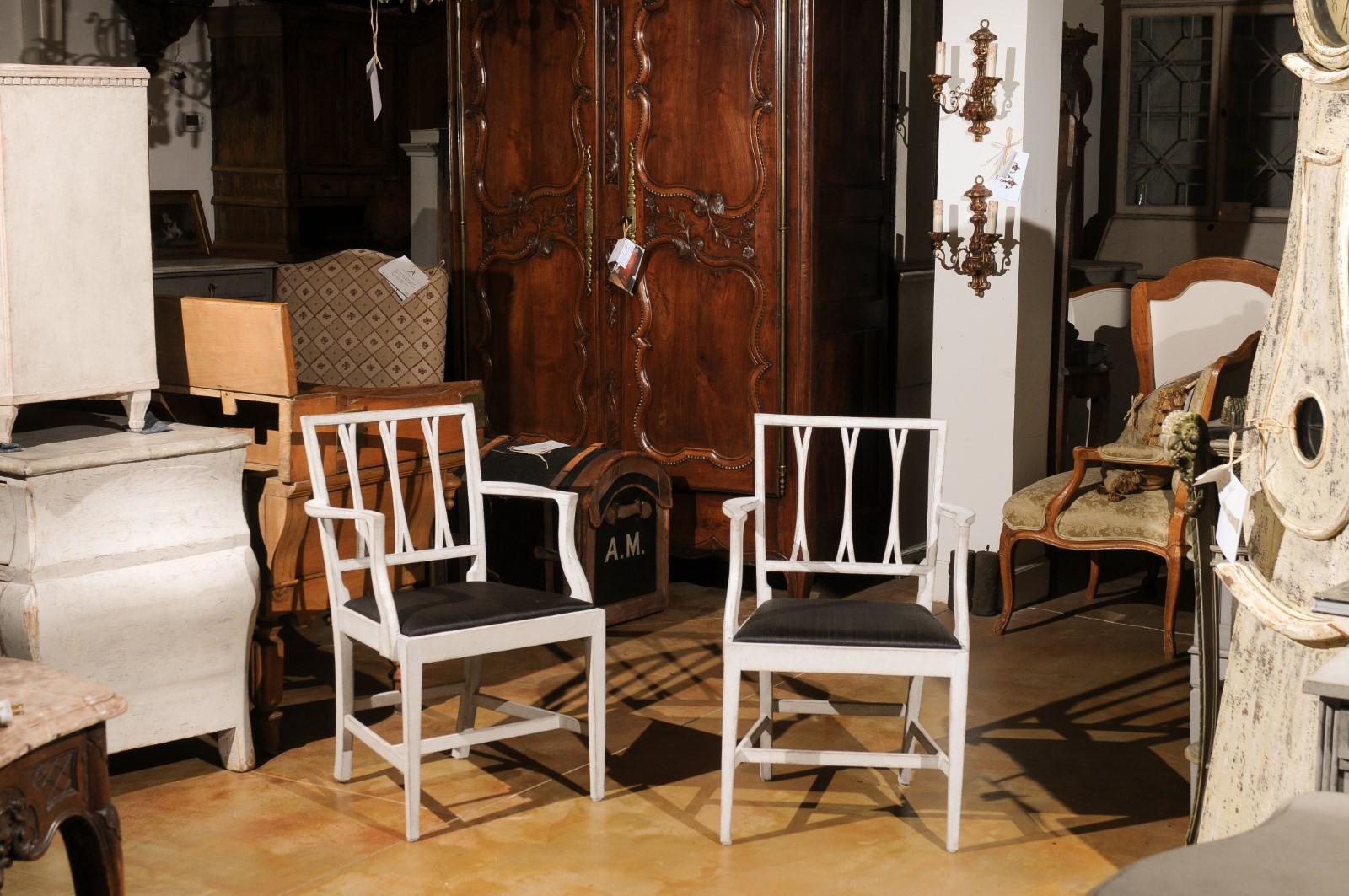 20th Century Pair of Swedish 1910s Painted Wood Armchairs with Carved Splats and Stretchers