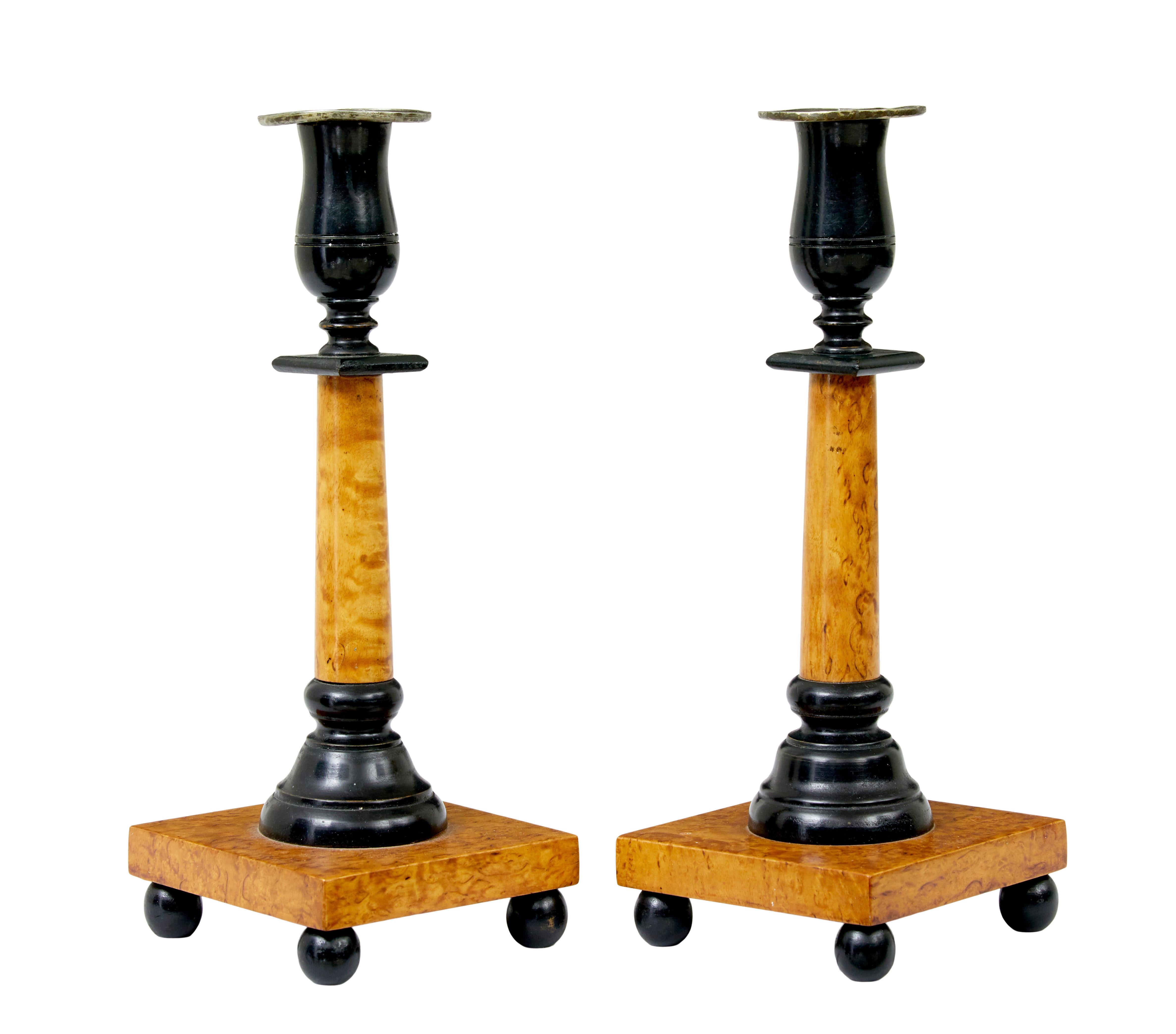 Pair of swedish 19th century karl johan masur birch candlesticks circa 1830.

Created in masur birch with contrasting turned ebonised elements, and pewter collars. Beautiful colour and patina.

Ready to adorn any table or mantlepiece.

Slight wear