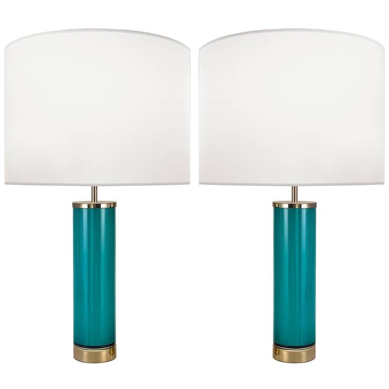 A pair of aqua glass lamps with brass hardware.

Swedish, Circa 1960's

Lamp Shades Are Not Included.

If you are interested in Lamp Shades, please email The Craig Van Den Brulle Design Team Via Message Center, and we will provide you with a