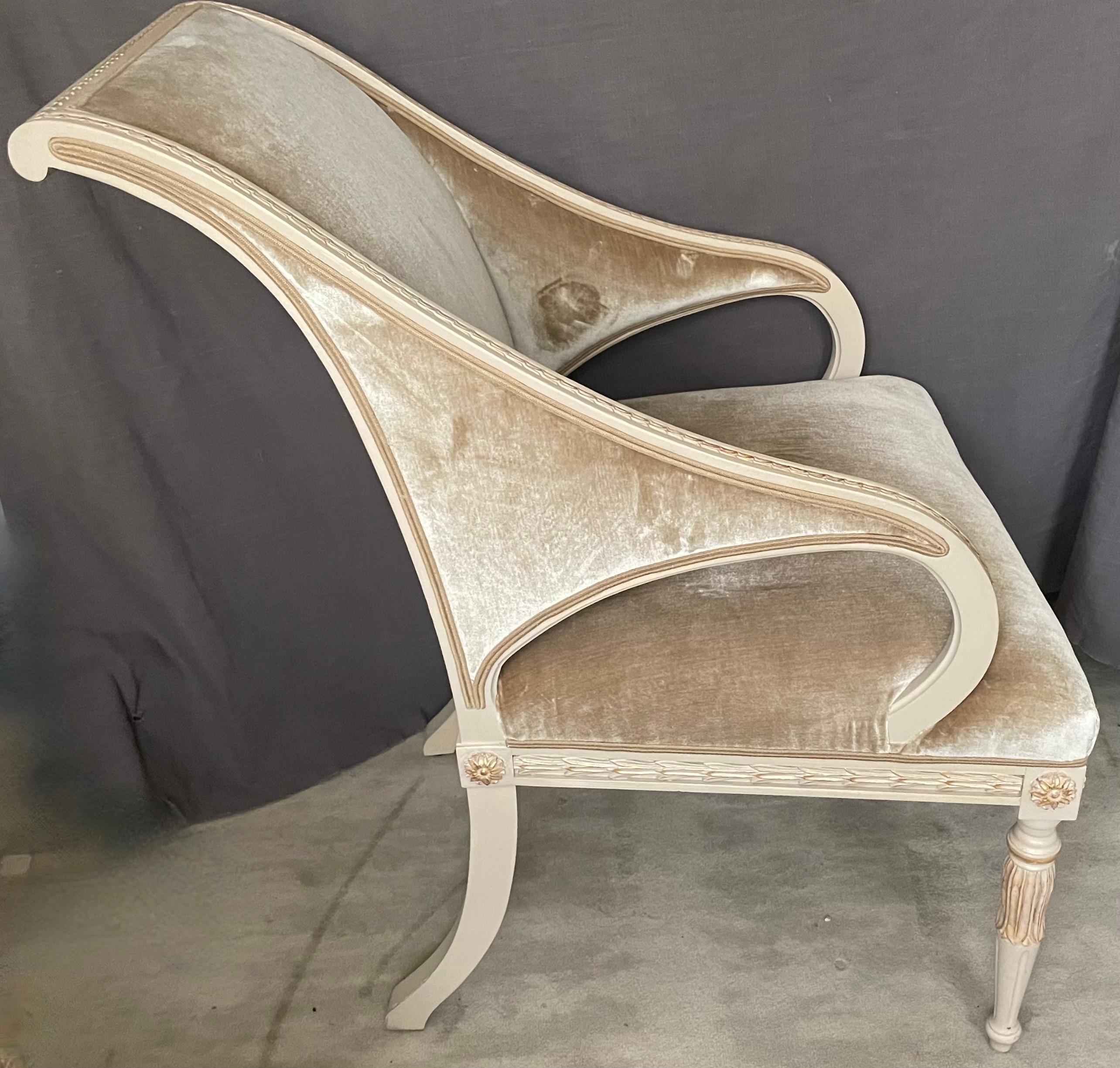 Pair of Swedish armchairs.  Vintage pair of Gustavian style painted open-arm chairs with neoclassical details; recovered in camel silk velvet with matching silk cotton piping; carved wood foliate banding and paterae  enhanced in soft gold paint. 