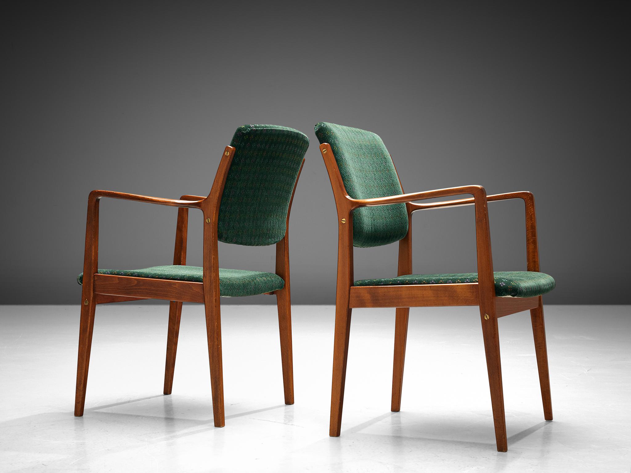 Manufactured by Åtvidabergs Snickerifabrik, pair of dining chairs, brass, teak, fabric, Sweden, 1960s.

These well-preserved solid wood and green velvet upholstered armchairs are in a beautiful condition. The wooden frame of this model is quite