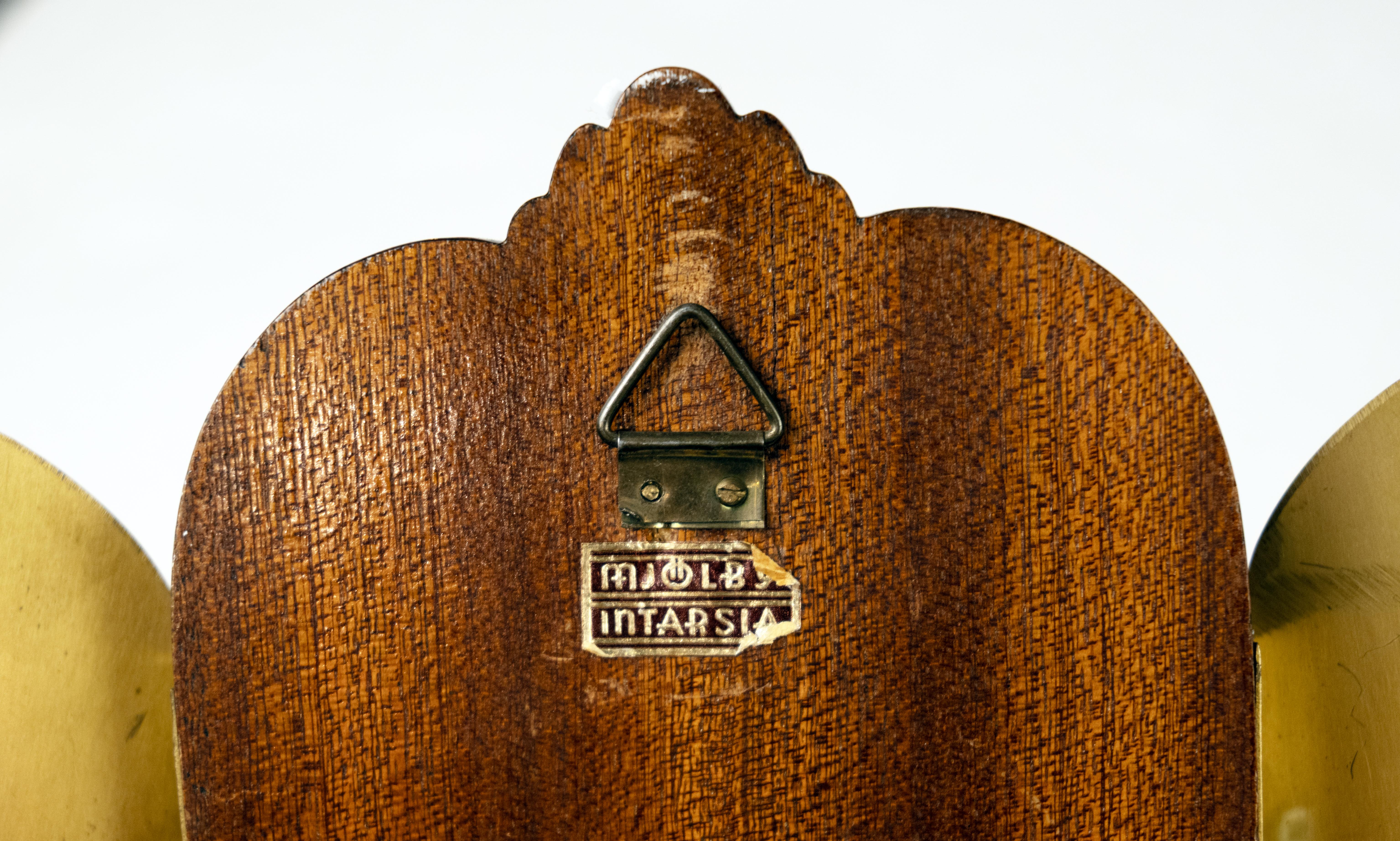 A pair of Swedish Art Deco two-light sconces made by Mjölby Intarsia. The detailed marquetry designs and penwork details depict two mythological figures in highly figured rosewood and birch. With maker's mark on the back. Price includes new UL