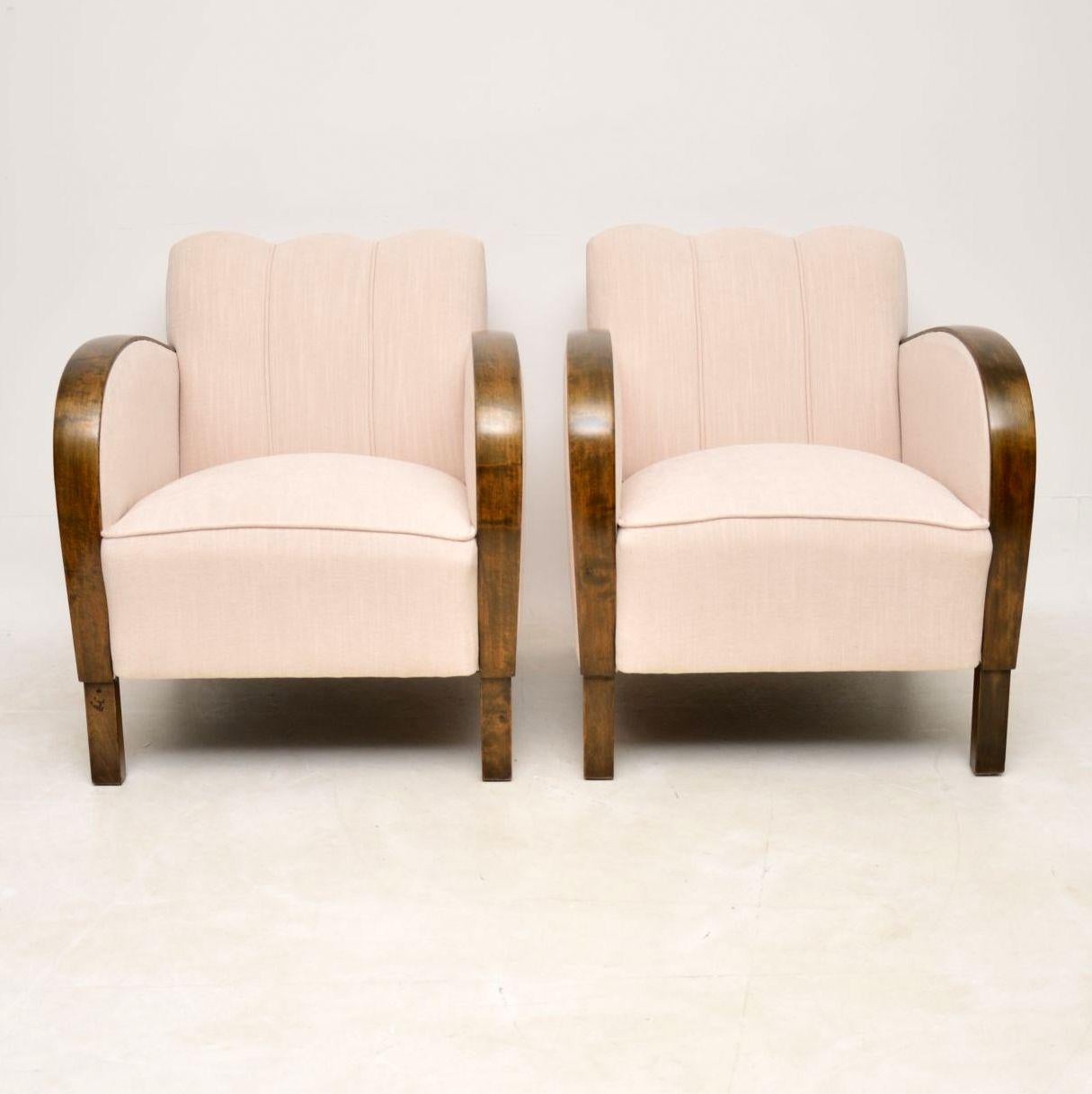 Stylish pair of original Swedish Art Deco armchairs with satin birch arms and feet, re-upholstered in a cream fabric with hand coiled springs in the seats. These armchairs date from the 1930s period and are in very good condition. We have tried to