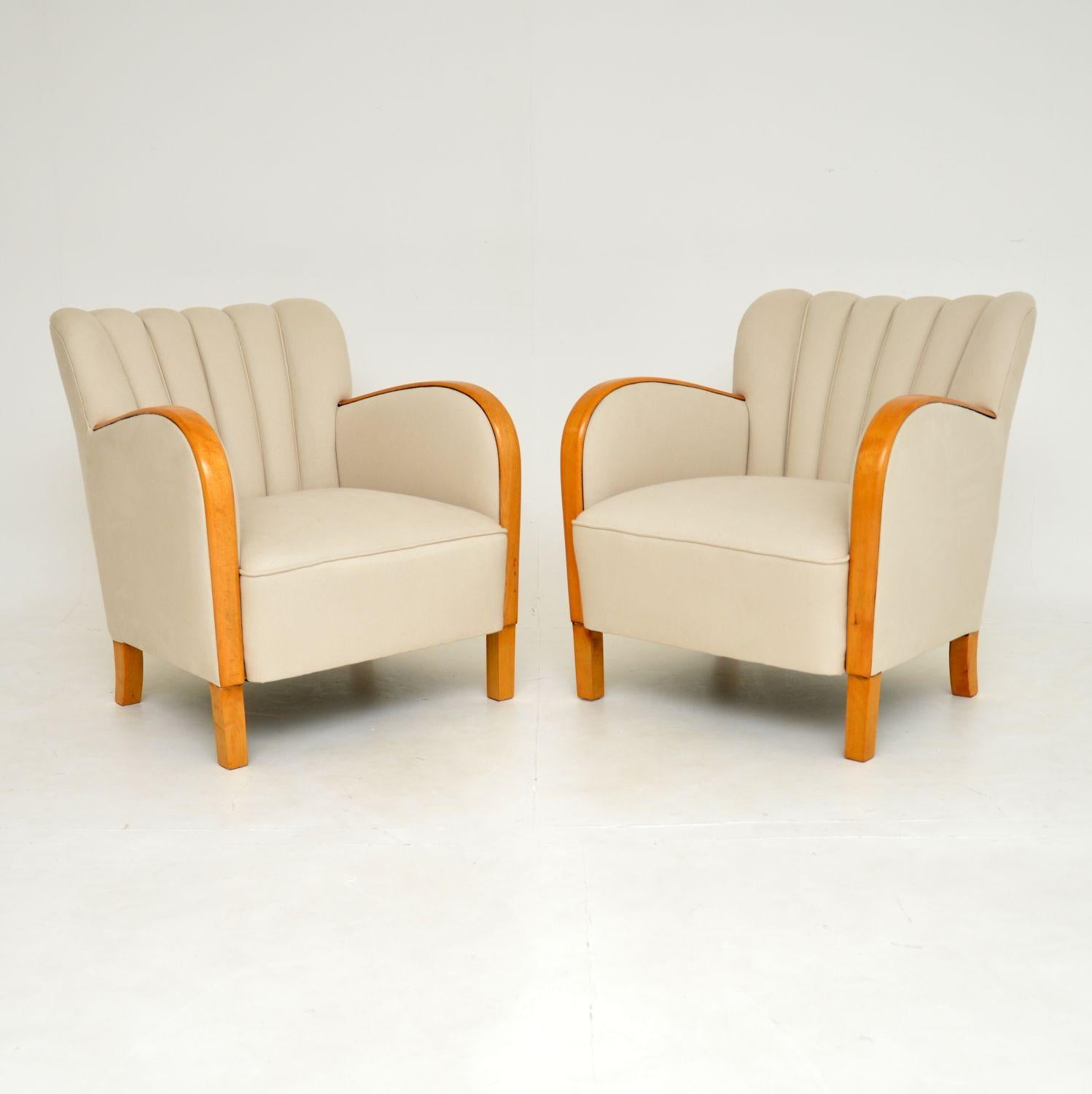 A very stylish pair of original Swedish Art Deco period armchairs, dating from the 1930’s period.

They are of superb quality and are very comfortable. They have wonderful scalloped backs and amazing satin birch on the arms and legs.

We have