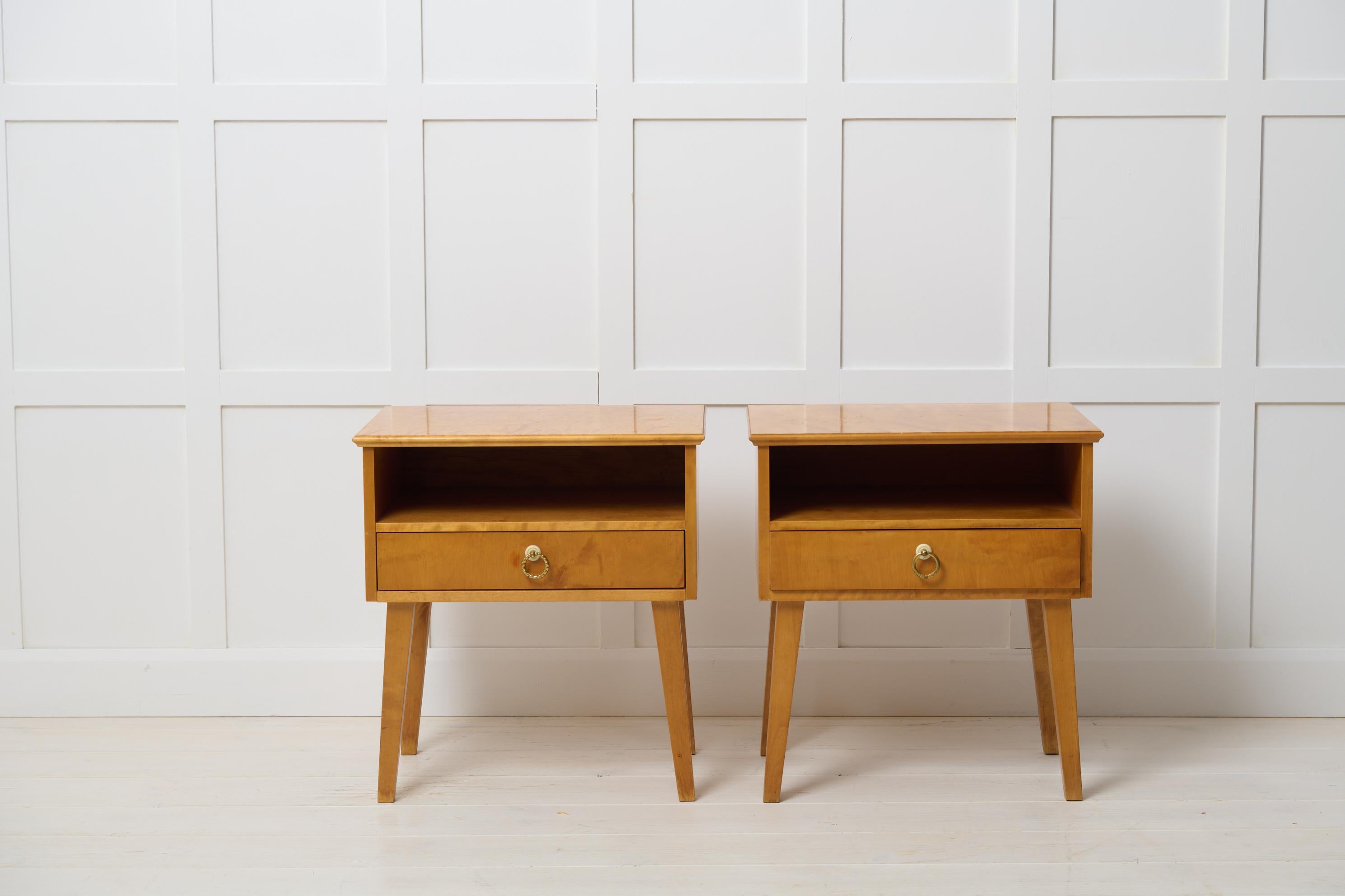 Swedish art deco style nightstands in light birch from around 1930. This pair of nightstands each have a drawer with original hardware. Good vintage condition. There are some smaller traces of use, for example on the legs close to the floor. 
