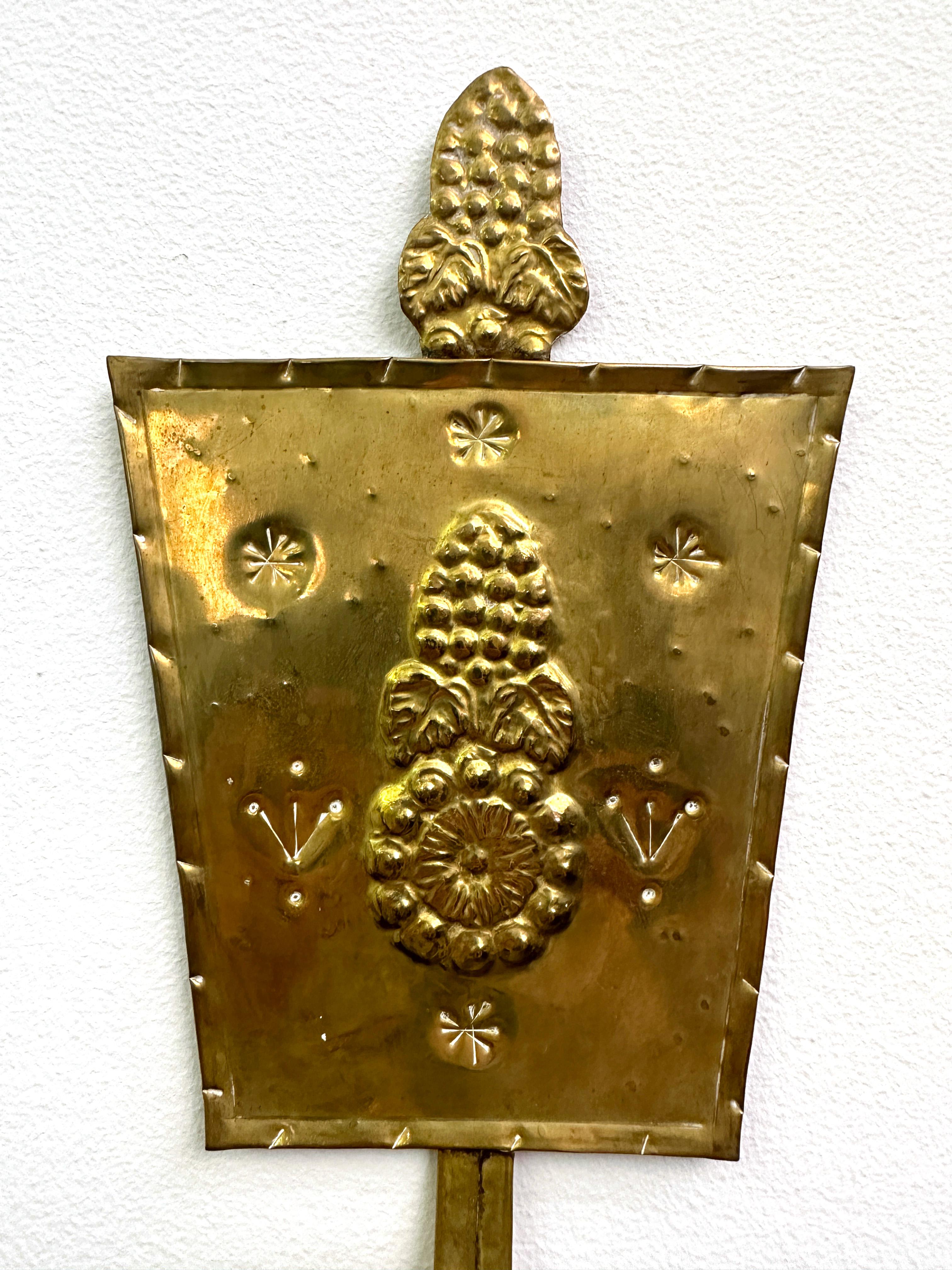 Pair of Swedish Arts & Crafts Repoussé Brass Wall Candle Sconces In Good Condition For Sale In New York, NY