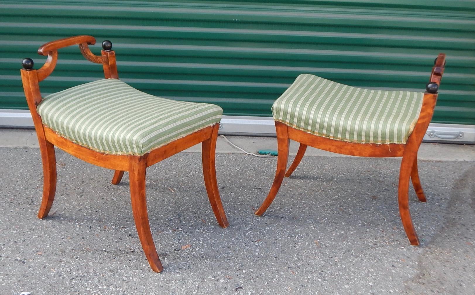 Pair of Swedish Biedermeier revival benches or stools. Rendered in golden birch wood with ebonized birch details. In original condition with no instability. In original fabric. Ready for a lifetime of good use, Sweden, circa 1920.