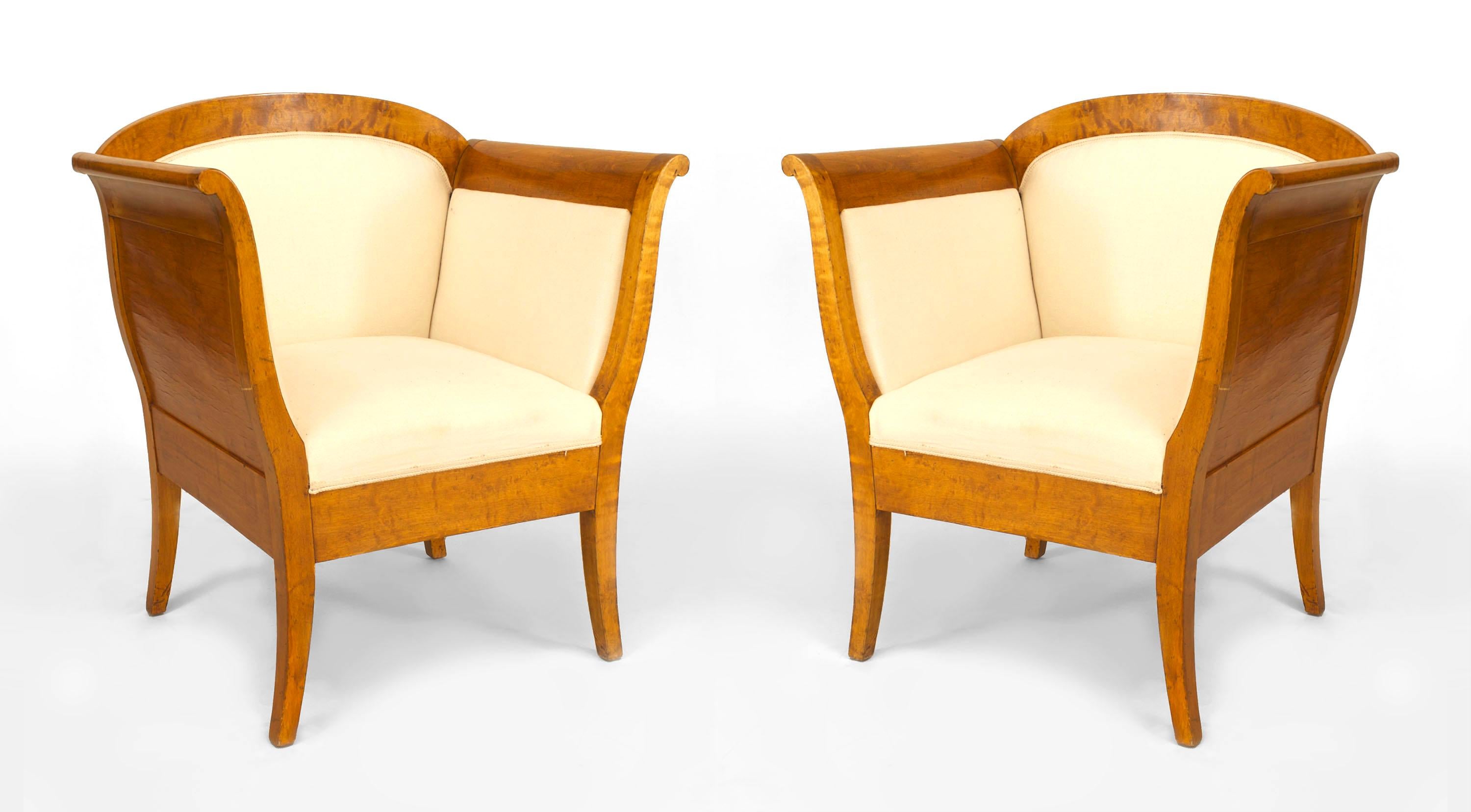 Pair of Swedish Biedermeier (1st Quarter 20th Century) birch bergeres / Armchairs with high flared arms and rounded back with white upholstery. (PRICED AS Pair)
