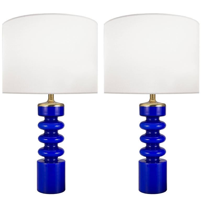 A pair of blue glass lamps with brass hardware.

Swedish, Circa 1960's

Lamp Shades Are Not Included.

If you are interested in Lamp Shades, please email The Craig Van Den Brulle Design Team Via Message Center, and we will provide you with a