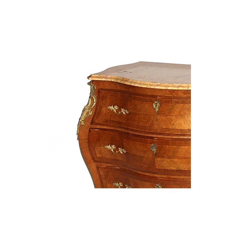 Fine pair of petite 19th century Swedish bronze mounted veneered kingwood bombe commodes with marble tops. 
The serpentine-fronted marble top over three long drawers mounted with foliate motif ormolu handles, resting on Sabre feet with bronze-cast