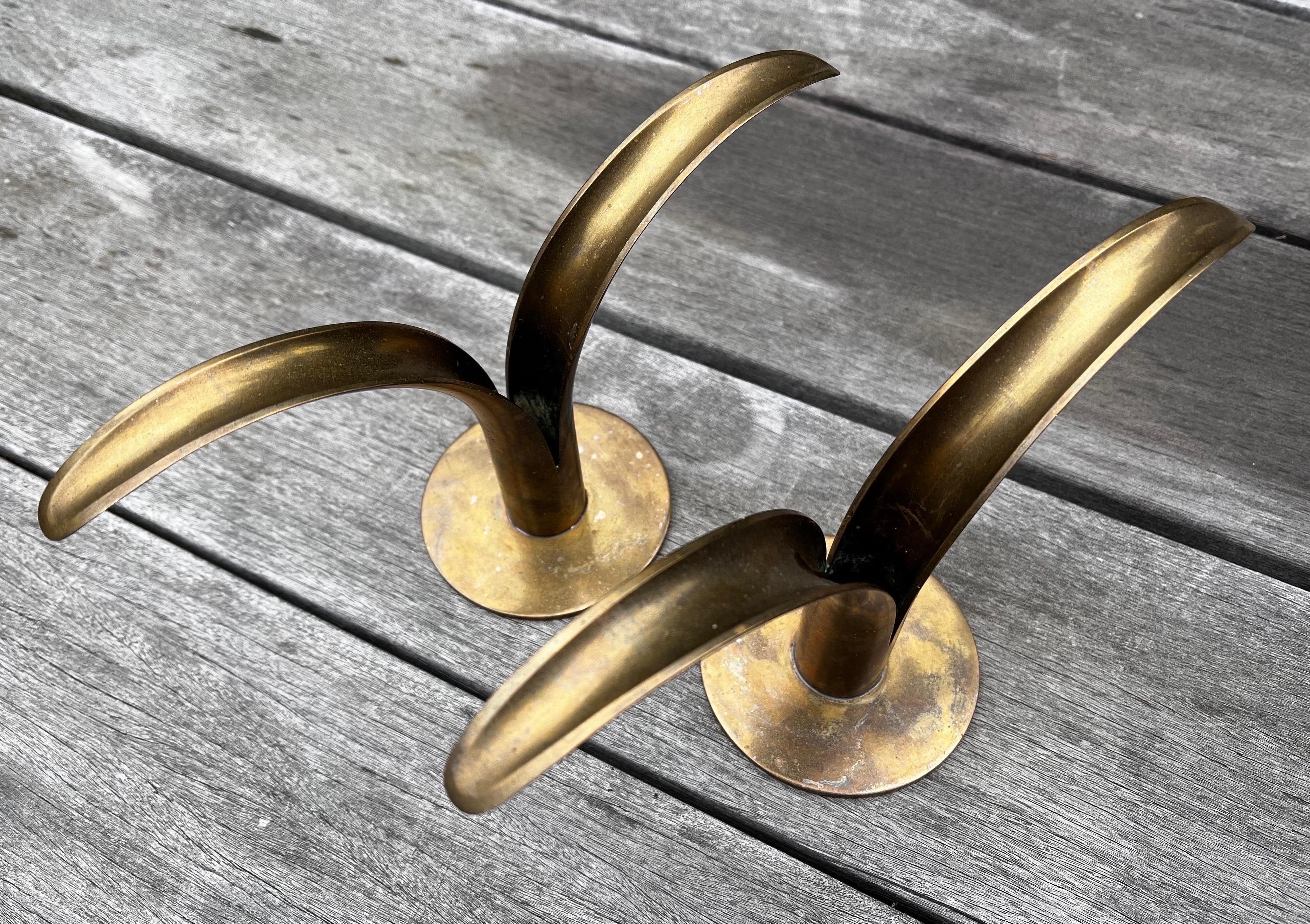 Pair of Mid-Century Modern brass candleholders 
by Ivar Alenius Bjork for Ystad Metal. 
Made in Sweden circa 1950s. 
Labeled on the bottom.
In very good original condition. 
Have not been polished.


