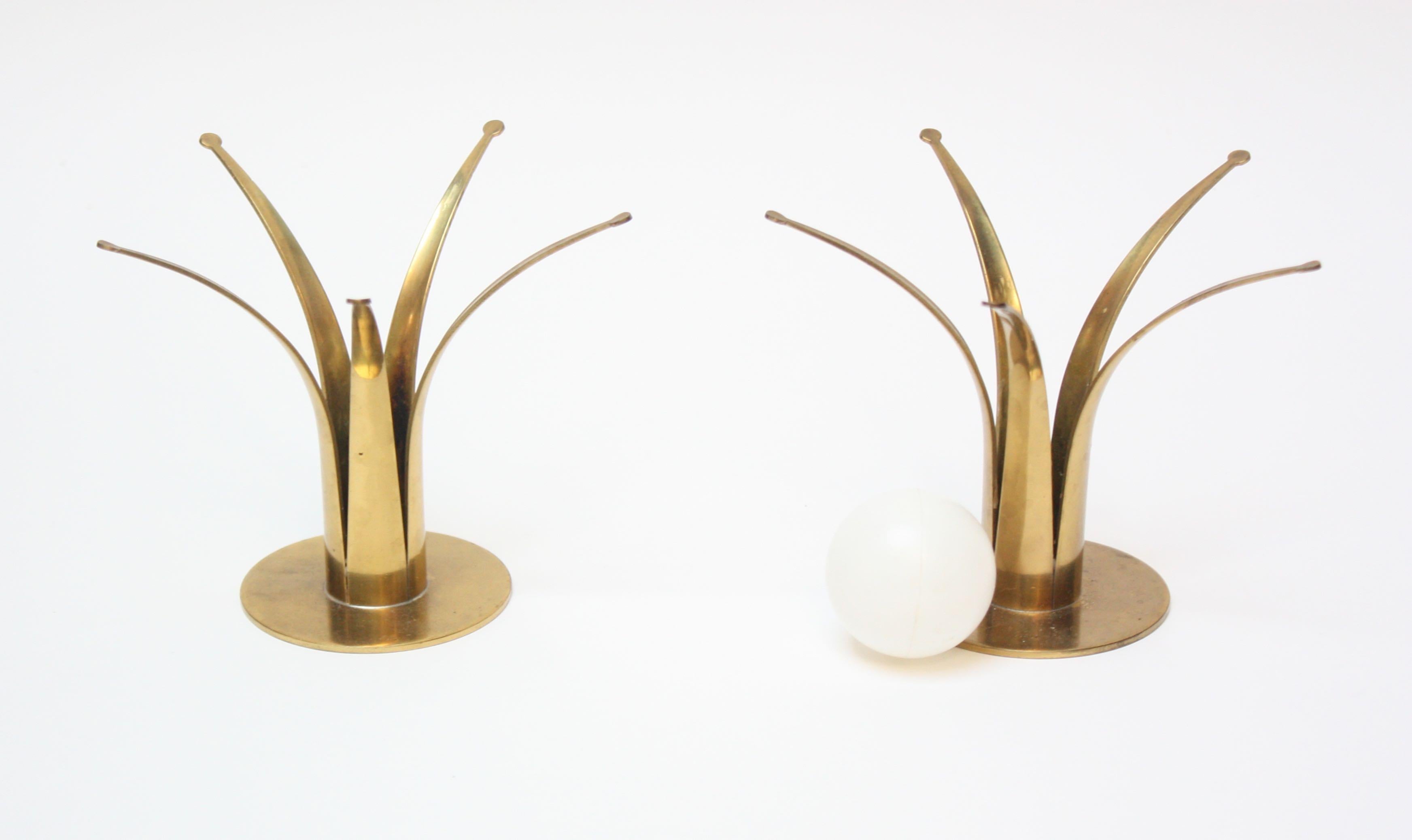 Pair of brass candleholders designed by Ivar Ålenius Björk for Ystad Metall in the 1950s. A more detailed / scarce variation of Björk's more ubiquitous 'lily' or 'liljan' design. Very nice, polished condition. Though, the pair has not been lacquered