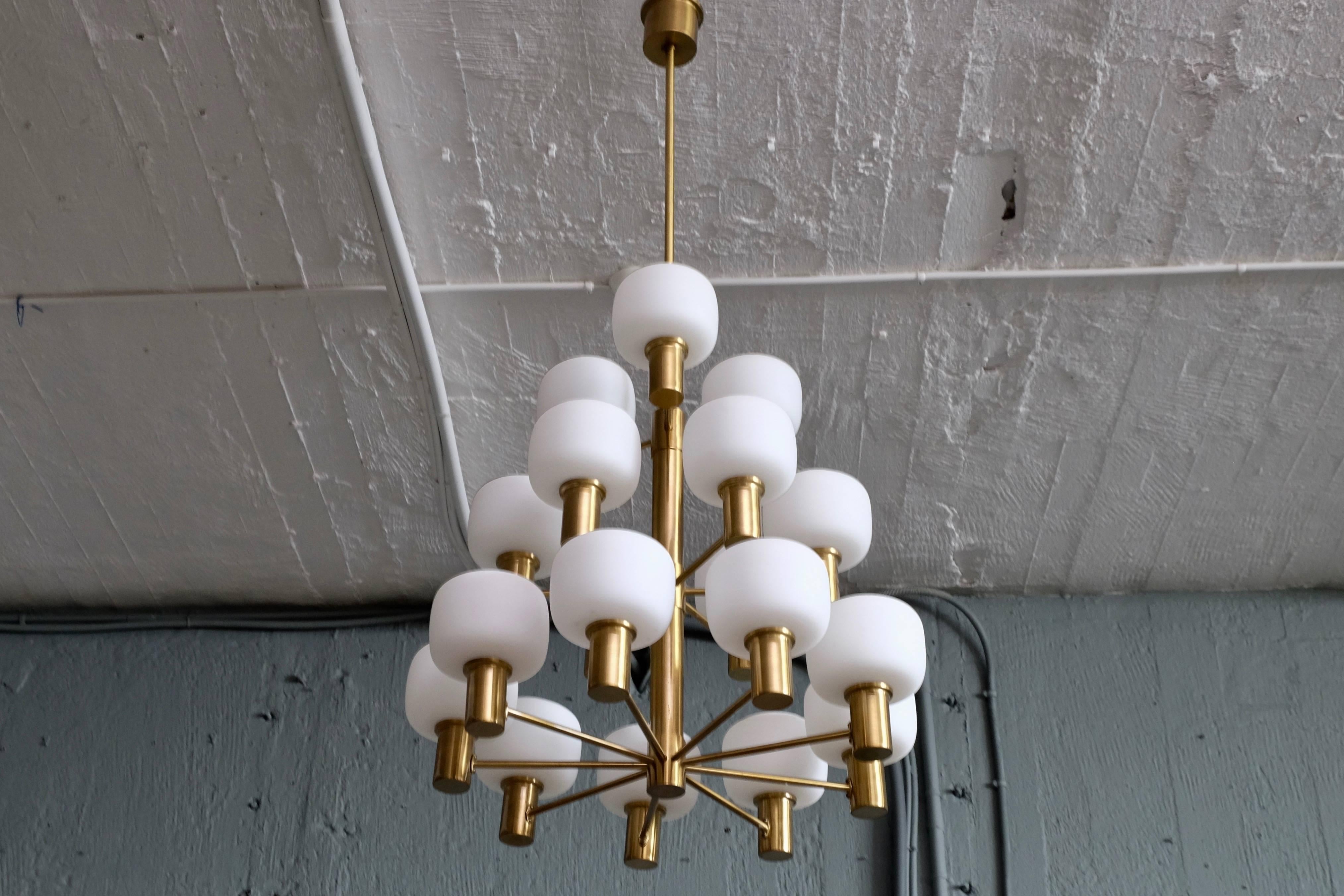 Excellent condition. Produced by ASEA, Sweden, 1950s. Brass and opaline glass.
Measures: Diameter 60 cm
Height: Adjustable according to your wishes, minimum 60 cm.

$6,000 is for one (1) chandelier.
      