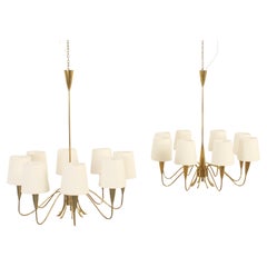 Paire de lustres suédois en laiton à huit bras, années 1950