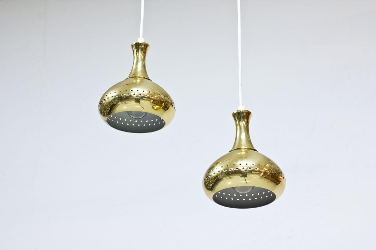 Pair of Swedish pendant lamps. 
Manufactured during the 1960s. 
Made from brass. New electricity. 
Lamps often attributed to Swedish designer Hans-Agne Jakobsson 
(similar type of design from the same period).