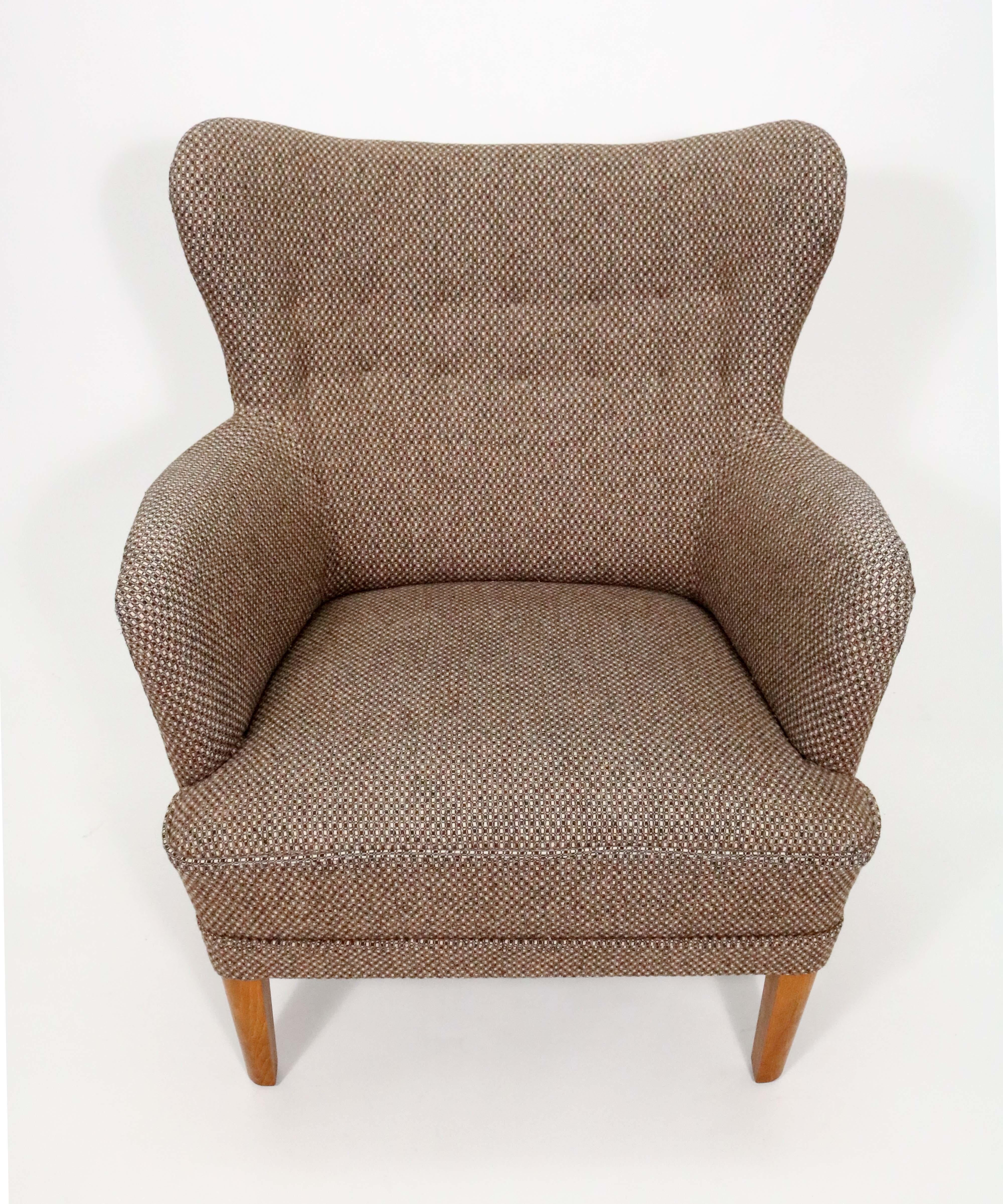 A complementary pair of chairs upholstered in a heavy tweed wool - a sophisticated barrel occasional chair and a mate in the manner of Carl Malmsten's take on the wingback chair. 

Both in excellent vintage condition.

Barrel chair dimensions: 28